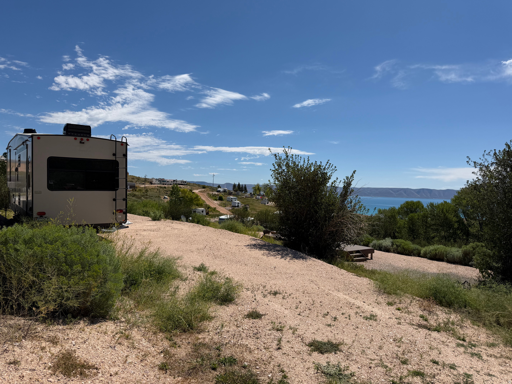Ready to start making memories at Bear Lake? This improved RV lot offers stunning views overlooking beautiful Bear Lake in Fish Haven, Idaho. The gravel pad is already in place, making it ready for your RV and immediate enjoyment. A unique advantage of this property is the opportunity to expand the usable RV area-by adding fill along one side, you could potentially gain approximately 10 additional feet of RV parking space, creating even more room for entertaining, parking, or outdoor living. It will fit 2 RV's as is. Enjoy peaceful surroundings, breathtaking lake views, and easy access to boating, beaches, trails, and all that the Bear Lake area has to offer. Whether you're looking for a seasonal getaway or a relaxing retreat, this lot is ready for your vision.