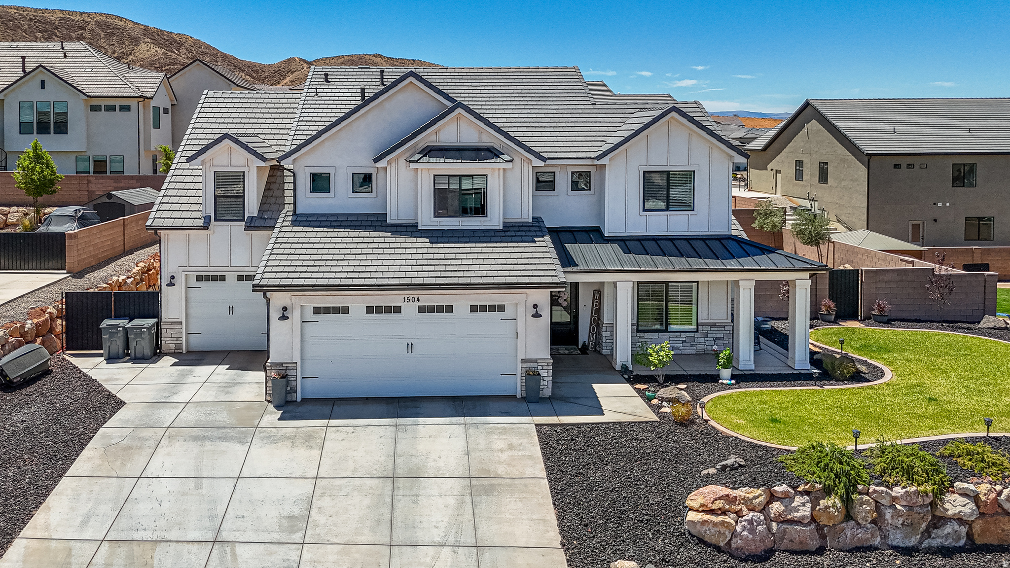Stunning custom home by Desert Sage located on an elevated lot in the highly sought-after Shooting Star community, offering breathtaking views and exceptional indoor-outdoor living. This beautifully upgraded home features quartz countertops throughout, a floor-to-ceiling stone fireplace, automatic blinds and plantation shutters on the main level, blackout shades in the primary suite, a Nest smart home system, and a versatile flex room ideal for a media room, exercise room, or additional bedroom. Designed for entertaining, the backyard boasts a partial in-ground swim spa, 6-person hot tub, putting green, and low-maintenance yard with artificial turf and desert landscaping. The oversized 3-car garage includes an extra-deep third bay and built-in storage cabinets, with abundant storage throughout the home. Situated on a large lot in a quiet neighborhood near parks, pickleball courts, schools, shopping, dining, recreation, and freeway access, this property offers the perfect combination of luxury, comfort, and Southern Utah living!