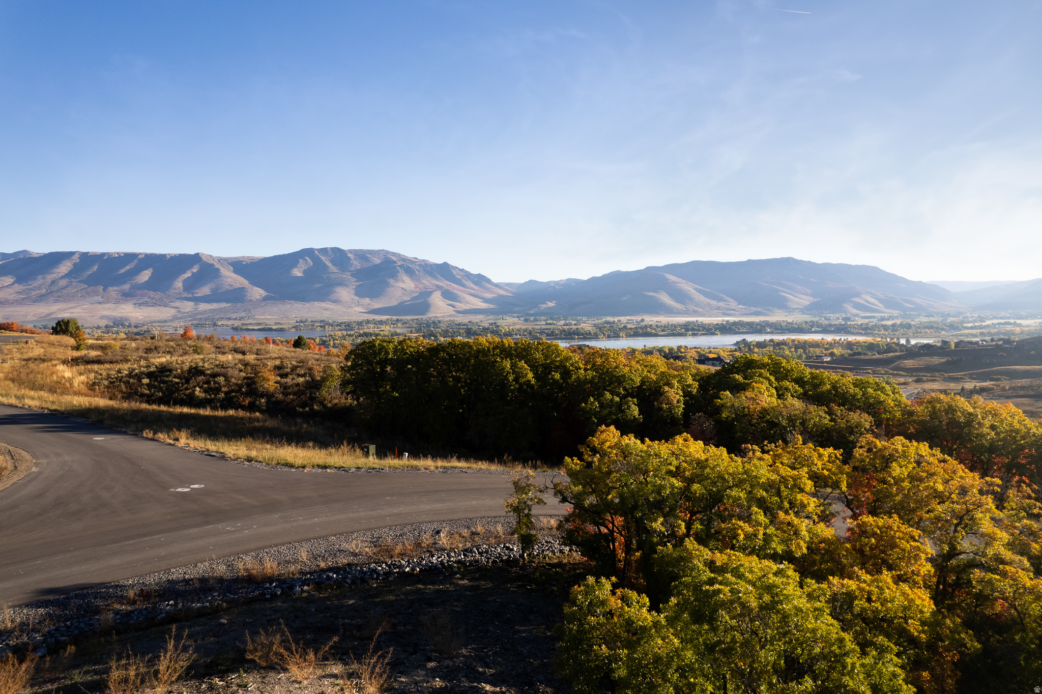 ** New Price! ** Welcome to Legacy Mountain Estates, Ogden Valley's premier luxury home community. Don't miss the opportunity to build your dream home on Lot 22. This beautifully positioned 22 acre homesite sits along a private, wooded gentle slope, creating the perfect opportunity for your walk out basement. This lot offers a peaceful sense of solitude and an ideal environment for a mountain retreat. Ogden Valley is a four-season destination with outdoor recreation available year-round. For boating and lake-sport enthusiasts, your new home is just minutes from the pristine waters of Pineview Reservoir, with convenient access to beaches and boat ramps. If quiet mountain trails are more your style, Legacy Mountain Estates provides exclusive access to miles of world-class hiking and mountain-biking trails, winding through forested ridges and open meadows. As winter arrives, you're perfectly situated to explore Ski Magazine's top-ranked Western resorts - Powder Mountain and Snowbasin Resort - both only a short 15 to 25-minute drive away. And when the snow melts, your homesite includes a 1-year complimentary Wolf Creek Resort Golf Membership, inviting you to play 18 scenic holes surrounded by panoramic valley views. This is a fully improved lot, and water and sewer connection fees have already been paid, providing added value as you begin planning your build. Lot 22 at Legacy Mountain Estates offers luxury, privacy, and stunning views - the perfect place to realize your mountain dream home.