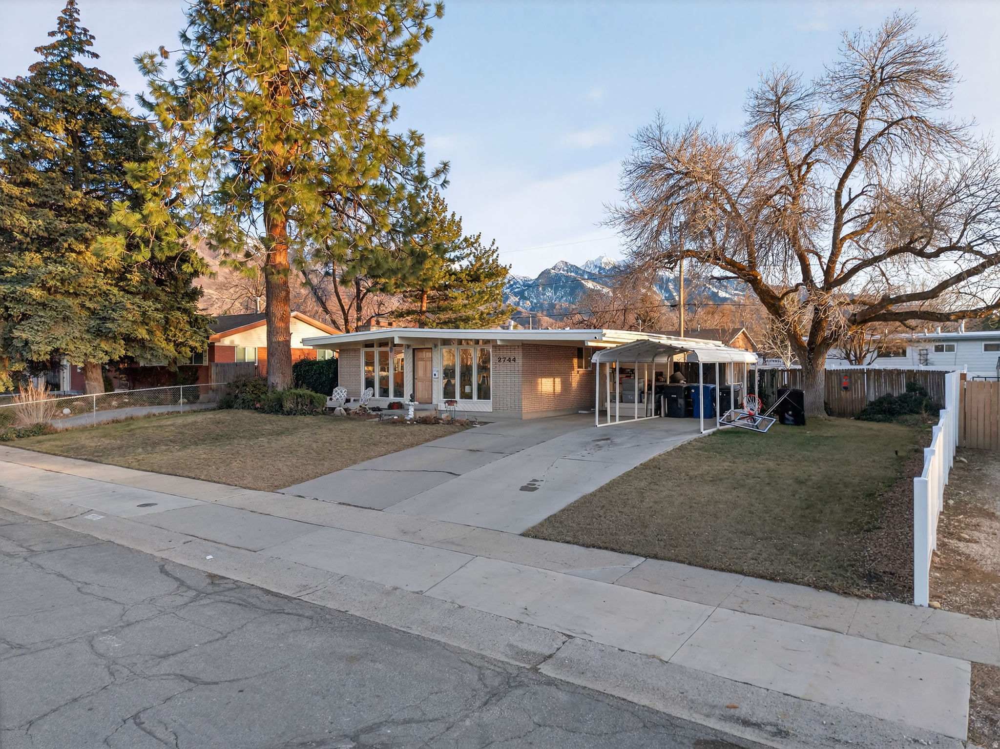 Situated in one of Cottonwood Heights' most desirable neighborhoods, this beautifully maintained home blends comfort, space, and convenience. Hardwood floors span the main level, creating a warm and welcoming feel throughout. The home offers five bedrooms, two and a half bathrooms, plus a versatile lower-level den or office ideal for remote work or flex living.  Two fireplaces provide cozy gathering spaces, while the brand new basement bath with an oversized soaking tub, and private half bath in the primary bedroom add thoughtful functionality. A newer, oversized central A/C unit ensures year-round comfort.  Enjoy a fully fenced backyard with mature landscaping and automatic sprinklers-perfect for summer evenings, weekend barbecues, or quiet mornings outdoors. The basement offers generous storage to keep everything organized.  Ideally located near shopping, dining, freeway access, and within walking distance to local schools and the recreation center featuring indoor ice skating and indoor and outdoor swimming.  A rare opportunity in a prime Cottonwood Heights location-schedule your showing today.  Square footage figures are provided as a courtesy estimate only and were obtained from County Records.  Buyer is advised to obtain an independent measurement.