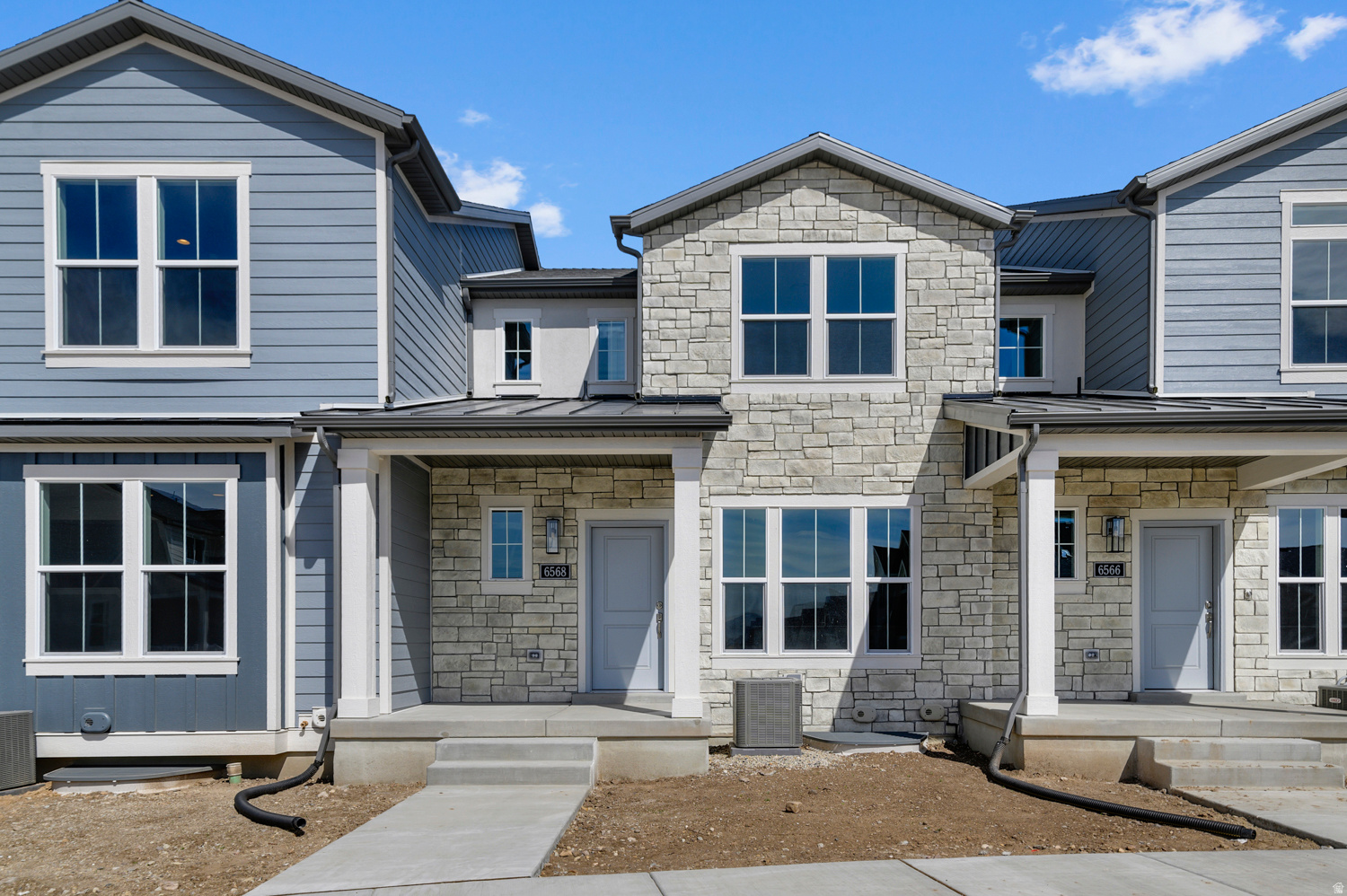 Step into modern comfort with this brand new Bellevue Townhome designed with style and functionality! This home features a beautiful kitchen with modern white laminate cabinets, elegant quartz countertops, tile backsplash and stainless steel gas appliances. Durable laminate hardwood, vinyl tile, and carpet flooring flow throughout the space while other highlights include an energy-saving tankless water heater, two-tone paint and craftsman base and casing. In the owner's bathroom, relax with cultured marble shower surrounds, accented by sleek satin and brushed nickel hardware. Comes fully landscaped that is maintained by the HOA for hassle free living. All in a great master planned community near parks, schools, shopping and more!