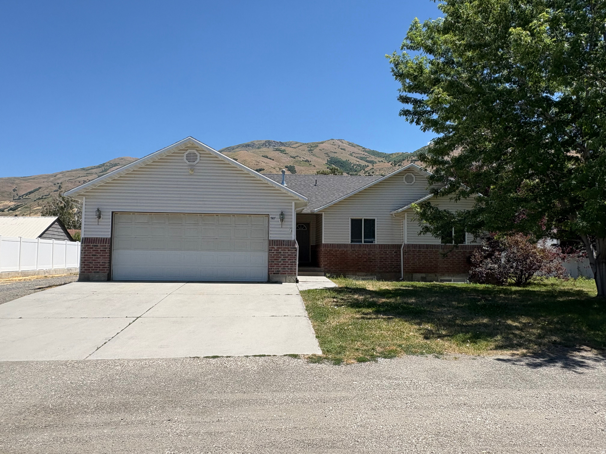 Spacious 6-Bedroom Home on a Semi-Secluded Lot in Perry, Utah Opportunity awaits in Perry! This nearly 3,000 sq. ft. home offers space, flexibility, and incredible potential for buyers looking to create their dream home. Nestled on a large semi-secluded lot along a semi-private road with beautiful mountain views, this property provides a peaceful setting while still being conveniently located near local amenities. Inside, you'll find 6 bedrooms and 2 full bathrooms plus a  bathroom, providing plenty of room for family, guests, hobbies, or a home office. The full basement offers additional living and storage space, with approximately 35% already finished, leaving ample opportunity to customize the remaining area to fit your needs. The home features a 2-car garage and abundant space for RV parking, trailers, recreational vehicles, and extra vehicles. Pet owners will appreciate the generous outdoor space and pet-friendly environment, making it easy for furry family members to enjoy the property as much as you do. While the home could benefit from new carpet and a little TLC, it's priced to reflect the opportunity and offers tremendous value for buyers with vision. Whether you're looking to build equity, renovate to your tastes, or simply enjoy the extra space, this property is ready for its next chapter. Bring your ideas and unlock the full potential of this Perry home. Square footage figures are provided as a courtesy estimate only and were obtained from seller.  Buyer is advised to obtain an independent measurement.