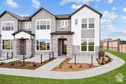 FINAL CLOSEOUT OPPORTUNITY in the gated community of Bonneville Towns! Welcome to the Ronan by David Weekley Homes, a thoughtfully designed 2-story townhome offering 1,717 square feet of bright, open living space. The heart of the home is a spacious kitchen with a large island, abundant storage, and seamless flow into the dining and family rooms-perfect for entertaining and everyday living. Upstairs, the private Owner's Retreat features a walk-in closet and en-suite bath, while two additional bedrooms provide flexibility for family, guests, or a home office. What truly sets this home apart is the value beyond the floor plan. Enjoy a 2-car garage PLUS driveway parking for 2 additional vehicles. The convenient two-story design offers fewer stairs and more usable living space than many townhomes on the market today. Built with James Hardie siding, 30-year architectural shingles, and a high-efficiency 96% furnace, this home was designed for durability, energy savings, and peace of mind. Enjoy a low HOA of just $150 per month and NO reinvestment fee. Buy with confidence from David Weekley Homes, known for exceptional customer satisfaction, quality craftsmanship, and industry-leading warranty protection. Before you buy, compare HOA fees, parking, number of stairs, energy efficiency, construction quality, warranty coverage, and future resale costs. You'll quickly see why Bonneville Towns stands apart. One of the final opportunities to own in this community. More parking. Fewer stairs. Lower monthly costs. Better long-term value.