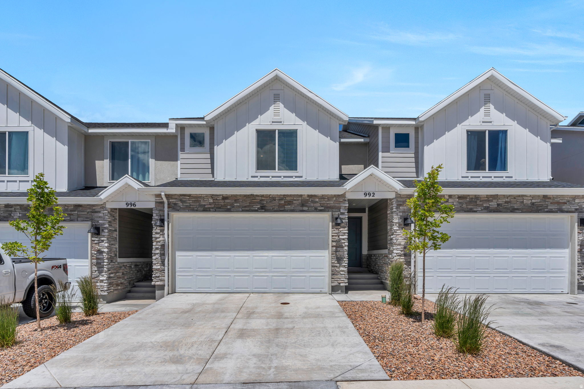 Welcome to this beautiful 3 bedroom 2.5 bath townhome in the heart of Santaquin! This move-in ready home features quartz countertops, stainless steel appliances, a gas range, smart light switches, and an ADT security system already in place for added peace of mind.  Enjoy breath taking mountain views, a fully fenced back patio perfect for relaxing.  Enjoy a functional open layout designed for comfortable everyday living.  Inside, you'll find spacious bedrooms with walk-in closets, offering generous storage.  This home blends modern finishes with everyday functionality, making this home both stylish and practical.  Conveniently located near schools, parks, shopping, and outdoor recreation.  This home offers the perfect balance of small town charm and modern convenience.  Just minutes away from the popular Rowley's Red Barn, Harvest view sports complex, pickleball courts, shopping and more! AMENITIES INCLUDE-swimming pool, pickleball and sand volleyball courts, playground, all-terrain park, tot lot, dog park, and picnic areas.
