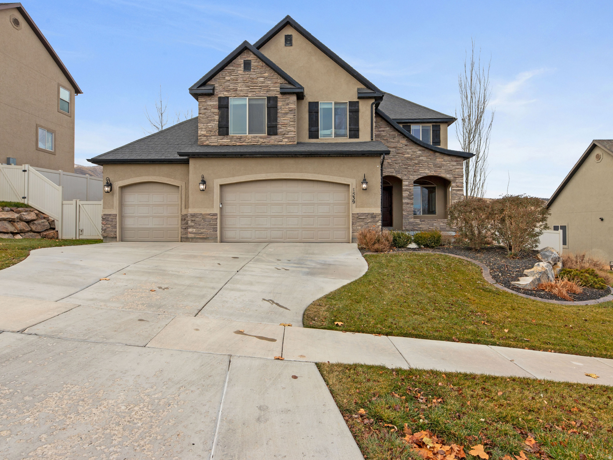 This well-cared-for two-story home with a finished basement offers exceptional space, comfort, and views. Built in 2007, the home features 7 bedrooms and 4.5 bathrooms across 3,051 total square feet, thoughtfully designed for both everyday living and entertaining.  The spacious layout includes multiple living areas, generous bedrooms, and a fully finished basement providing flexible space for guests, recreation, or a home office. A 3-car garage offers ample storage and parking, while the home sits on a .23-acre lot, providing room to enjoy outdoor living.  Enjoy stunning lake and mountain views, creating a peaceful backdrop year-round. This home has been well maintained and reflects pride of ownership throughout. Ideally suited for those seeking space, functionality, and scenic surroundings.   Square footage figures are provided as a courtesy estimate only and were obtained from county records.  Buyer is advised to obtain an independent measurement.