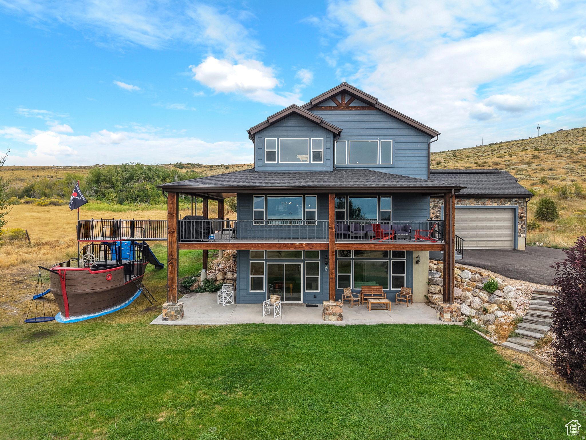 Experience mountain luxury redefined. This stunning mountain modern home blends sleek architectural design with the rugged beauty of its natural surroundings. Perched above Bear Lake, the home offers panoramic lake and mountain views from all levels. 7 bed 5 bath, full walk out basement, sold fully furnished, nightly rentals approved, and a full sized enclosed garage. Not to mention the fabulous custom made pirate ship play zone is a must see!