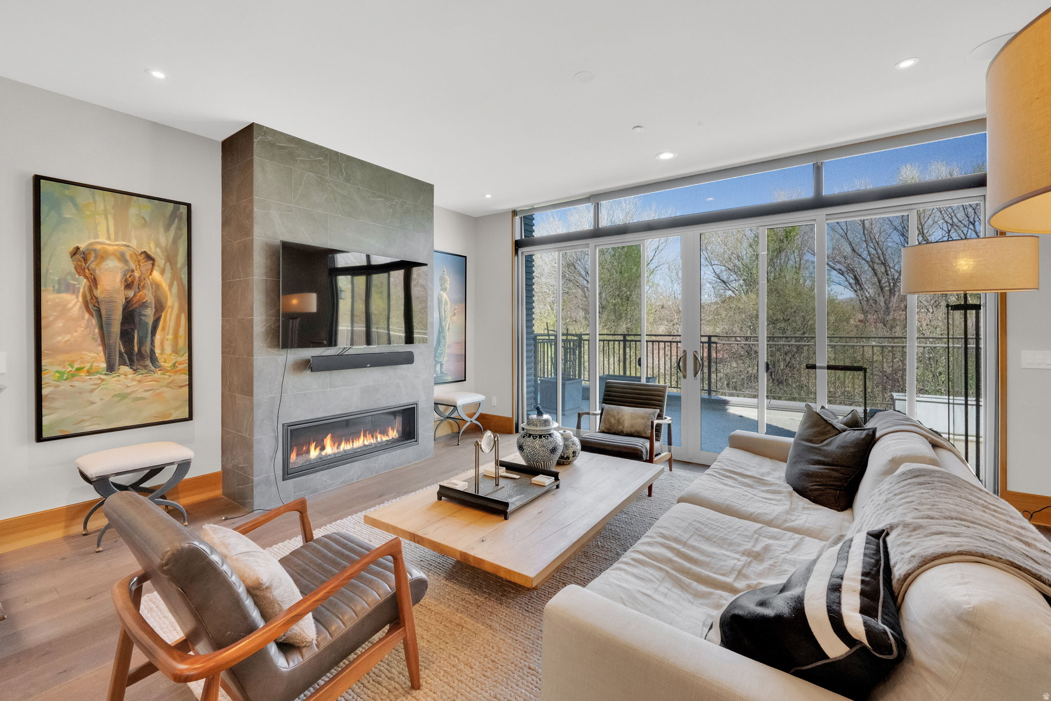 PRICE IMPROVEMENT.  Luxury living in the heart of Sugar House. Just steps from Sugar House Park, this condo features a rare, oversized wrap-around balcony-perfect for entertaining and taking in the views. Inside, you'll find high-end finishes throughout, including Wolf appliances, quartz countertops, custom cabinetry, and abundant natural light. Additional highlights include a dedicated office and a private wine cellar, adding both function and sophistication. Secure access, covered parking, and quick access to I-80, I-215, the University of Utah, and Westminster complete this ideal blend of lifestyle and convenience.