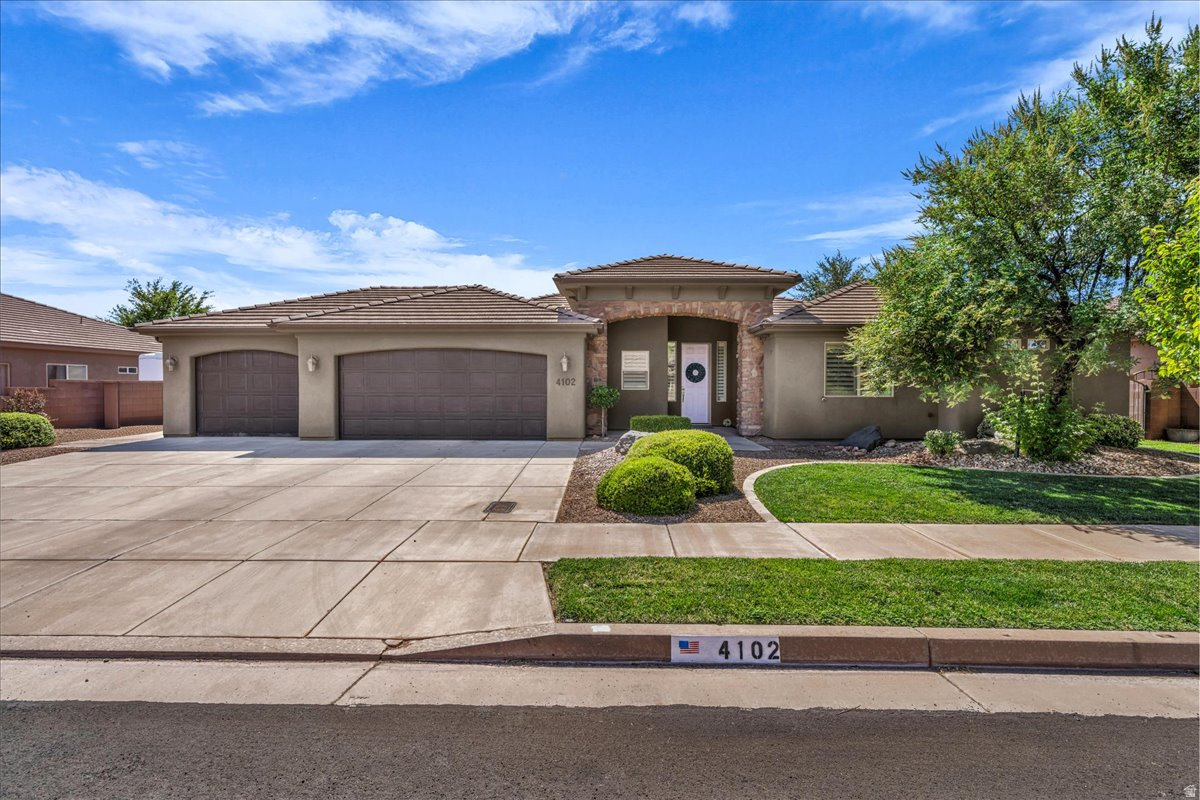 Located in the highly sought-after Washington Fields area within the desirable Treasure Valley community, this beautifully maintained, move-in-ready home offers the perfect blend of style, comfort, and convenience. Featuring a bright, open-concept floor plan, the spacious layout is ideal for both everyday living and entertaining. Hardwood floors, fresh interior paint, modern lighting, and tasteful updates throughout create a warm, inviting atmosphere that truly shows like a model home. The kitchen flows seamlessly into the living and dining areas, creating a functional space for gathering with family and friends. Step outside to the covered patio and enjoy the low-maintenance landscaping, perfect for relaxing year-round. Additional highlights include a three-car garage, abundant storage, and energy-efficient features. Conveniently located near top-rated schools, parks, shopping, dining, and recreational amenities, this exceptional home is one you won't want to miss.