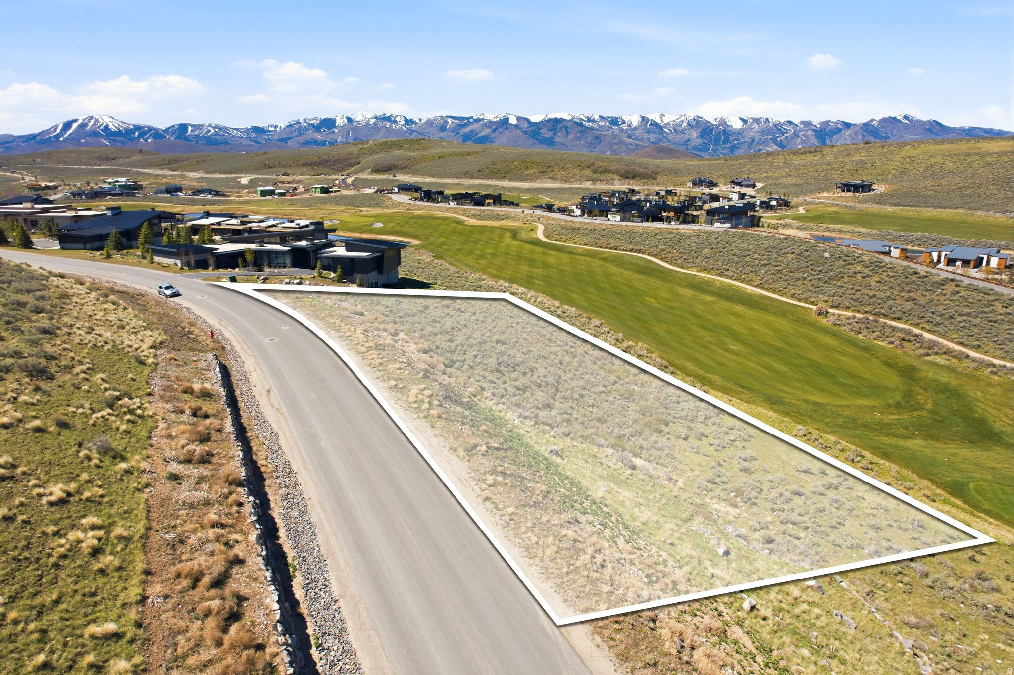 Perched above the 10th fairway of Promontory's renowned Nicklaus Painted Valley Course, this extraordinary 1.1-acre buildable lot in the exclusive Vista Point community offers an unparalleled opportunity to craft your dream mountain home. With expansive ski resort and golf course views, the property provides walkable access to the Nicklaus clubhouse, home to The Peak restaurant and Sage Spa. The coming soon third gate entrance off Browns Canyon Road, will greatly enhance accessibility to Park City and its surrounding adventures. Promontory's exceptional amenities elevate this lot from mere real estate to a lifestyle destination. Owners can enjoy two spectacular 18-hole golf courses, a new par 3 course, seven distinctive restaurants, a beach club, outdoor opportunities such as fishing and water sports at the Jordanelle Reservoir, and members-only lodges at both Park City Mountain Resort and Deer Valley. All of these world-class experiences are just a short 20-minute drive from the historic charm of Park City's Main Street, making this Vista Point lot the perfect destination for your dream home in the mountains.