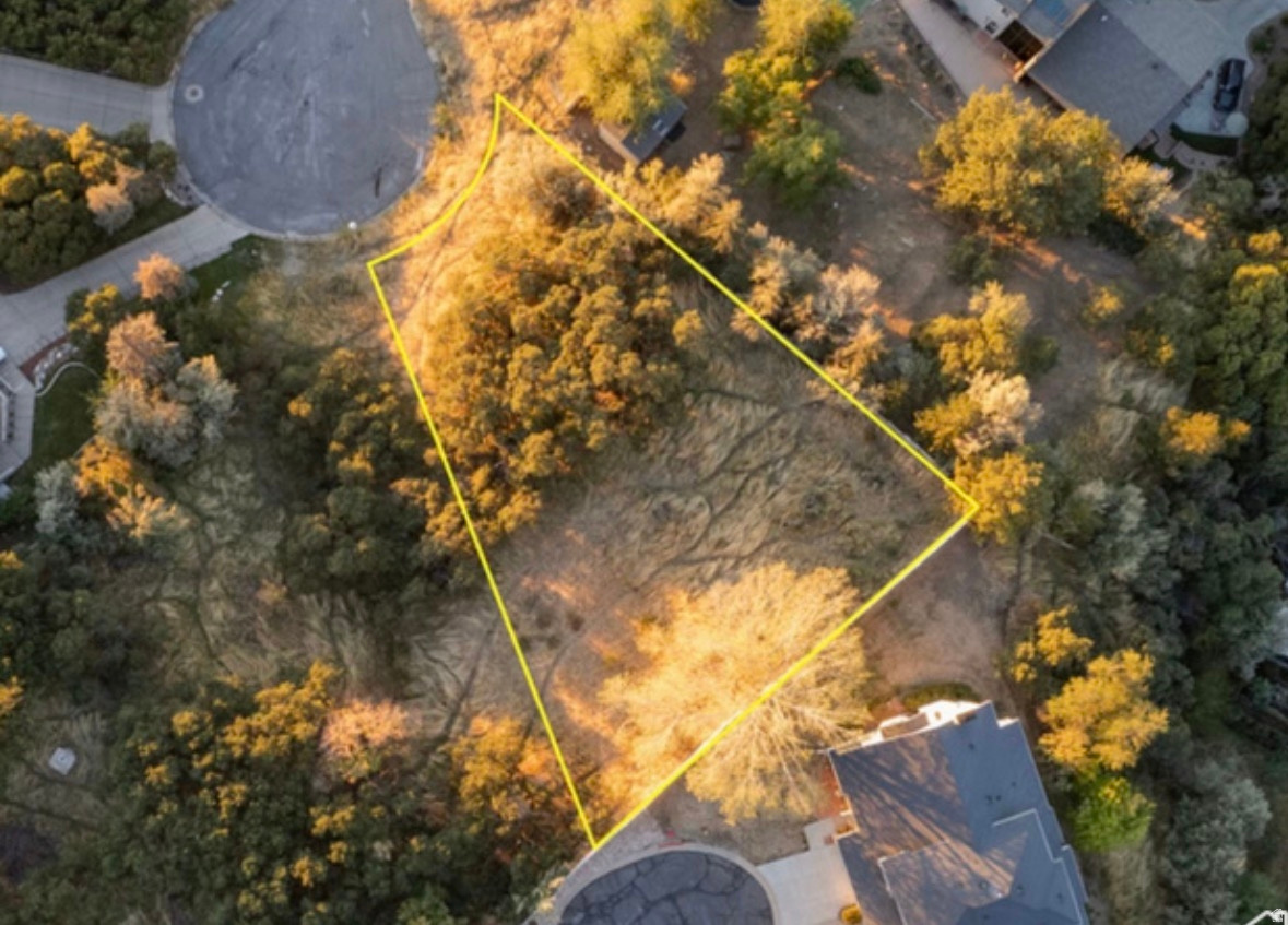 Prime East Bountiful Lot with Stunning Valley Views!  Discover the perfect canvas for your dream home with this exceptional 0.34-acre residential lot nestled in a serene cul-de-sac in East Bountiful. Boasting breathtaking lake, mountain, and valley views, this lot offers a peaceful retreat while still being conveniently located near essential amenities. With no HOA restrictions, you have the freedom to build the home you've always envisioned. The lot is zoned for single-family residential use and is surrounded by beautiful scrub oak for added privacy and natural charm. Don't miss this rare opportunity to secure your slice of East Bountiful's beauty.  Act now and make your vision a reality!