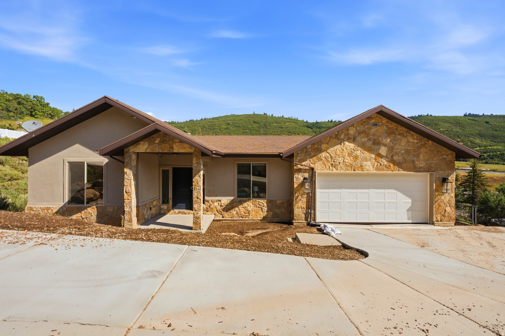 Perched on a hillside in coveted Summit Park, this Park City home pulls double duty: room to live large, plus a built-in income stream to help pay for it all. The main floor welcomes you at street level, light and bright and open, with mountain views pouring through the windows, vaulted ceilings, a gas fireplace, white oak hardwood floors, and a custom kitchen with quartz counters and stainless appliances that make it a space you actually want to gather in. Down a level, a fully finished flex space is ready to become whatever you need, whether a home gym, playroom, or theater room, and because the home is built smartly into the slope, it connects to the main house or folds into the rental below, so you decide how much space stays yours. Then the game-changer: a full, separate ADU with its own kitchen, laundry, and a private walkout to the backyard, ready to rent long term for steady income or cash in on Sundance and ski season, with short-term rentals allowed and a freshly restored driveway for parking to match. Freshly painted and move-in ready, tucked in one of Park City's most sought-after pockets, you're minutes from Historic Park City, world-class skiing, and endless trails, with Salt Lake City an easy drive down the canyon. Homes with real income potential here don't come along often, so come see it before it's gone.      Square footage figures are provided as a courtesy estimate only and were obtained from Cubicasa.  Buyer is advised to obtain an independent measurement.