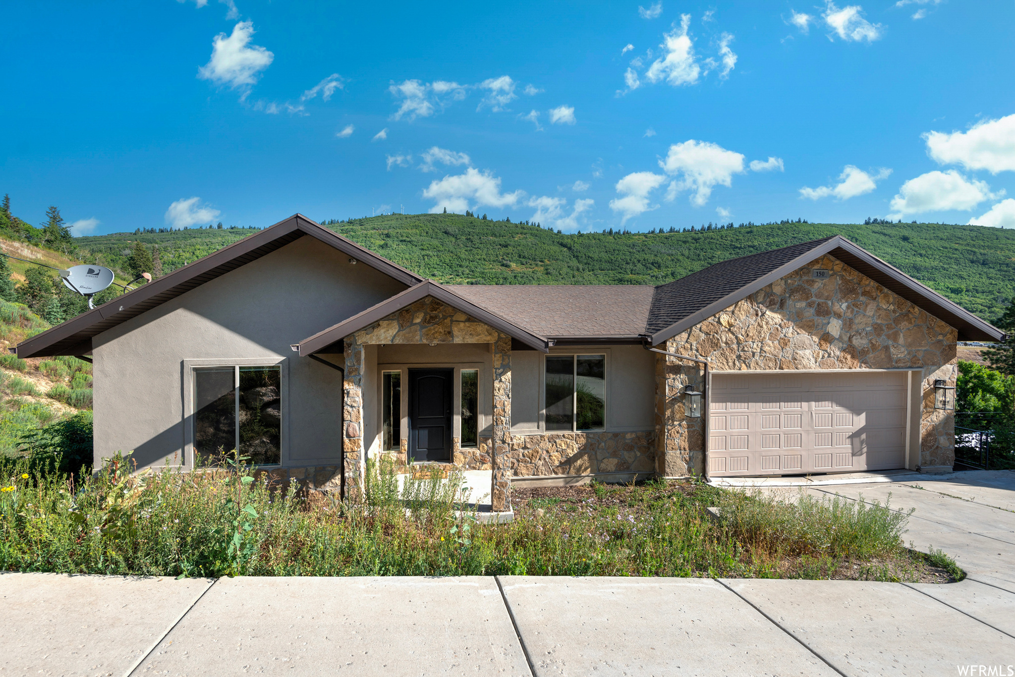 Perched on a hillside in coveted Summit Park, this Park City home pulls double duty: room to live large, plus a built-in income stream to help pay for it all. The main floor welcomes you at street level, light and bright and open, with mountain views pouring through the windows, vaulted ceilings, a gas fireplace, white oak hardwood floors, and a custom kitchen with quartz counters and stainless appliances that make it a space you actually want to gather in. Down a level, a fully finished flex space is ready to become whatever you need, whether a home gym, playroom, or theater room, and because the home is built smartly into the slope, it connects to the main house or folds into the rental below, so you decide how much space stays yours. Then the game-changer: a full, separate ADU with its own kitchen, laundry, and a private walkout to the backyard, ready to rent long term for steady income or cash in on Sundance and ski season, with short-term rentals allowed and a freshly restored driveway for parking to match. Freshly painted and move-in ready, tucked in one of Park City's most sought-after pockets, you're minutes from Historic Park City, world-class skiing, and endless trails, with Salt Lake City an easy drive down the canyon. Homes with real income potential here don't come along often, so come see it before it's gone.      Square footage figures are provided as a courtesy estimate only and were obtained from Cubicasa.  Buyer is advised to obtain an independent measurement.