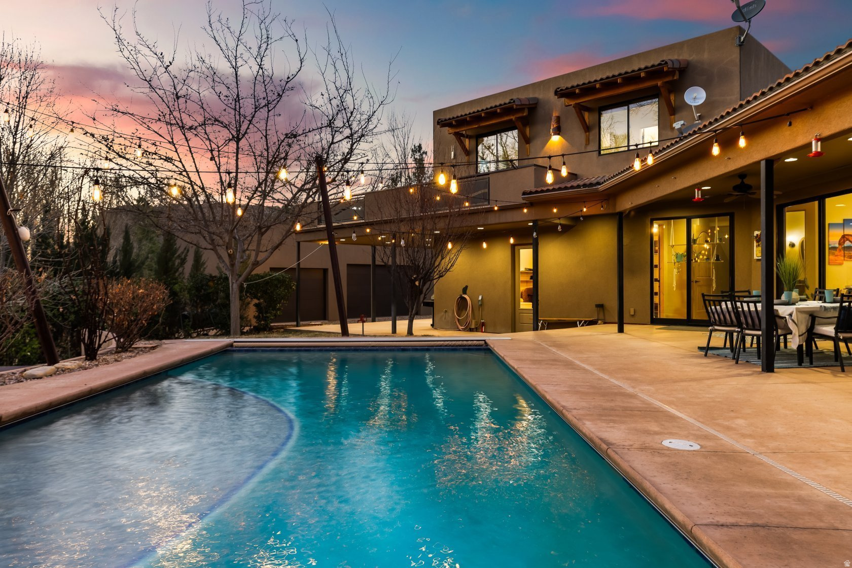Riverfront Living on the Virgin River. 1.41 Acres | Direct River Access | Custom Home + Workshop. Set along the Virgin River in Rockville, this custom built home features 1.41 acres with direct river frontage and access. Newly painted the home is ready with a fresh look and unobstructed views of Zion National Park. With a beautiful private pool, the home is back on the market looking clean, current, and move-in ready. The residence offers 4 en-suite bedrooms, a dedicated office, and 5.5 bathrooms, designed with a layout that supports both everyday living and large-scale hosting. The kitchen features custom cabinetry, and generous prep space, while additional interior amenities include a home theater, exercise room, and ample storage throughout. Additional property highlights include:  Two attached double garages  2,800 SF detached workshop with 220V hookups and three bay doors (accommodates 3-4 additional vehicles or equipment)  18,500-gallon underground water tank, connected to a pressurized irrigation system  Full solar system installed May 2021 (approx. $70,000 investment)  Two irrigation water shares included Outdoor features are fully integrated into the design, with multiple patios and deck areas oriented toward the river and surrounding landscape. A private sandy river bank provides direct access to the Virgin River, creating a rare outdoor feature that's both functional and visually striking. The in-ground saltwater pool is positioned for privacy and easy access from the main living areas. This is a unique property with a once in a lifetime opportunity to own a truly spectacular piece of paradise. Text GATES98 to 39200 for the full property website.