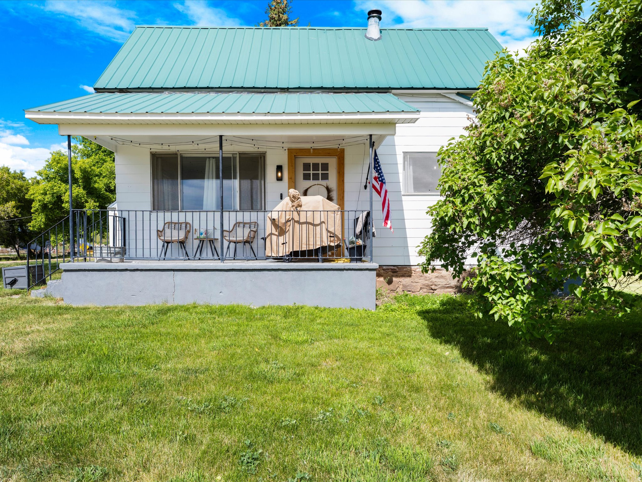 This updated 2-bedroom, 1-bathroom cottage in Saint Charles, Idaho, is perfectly situated just minutes from outdoor adventure! Spanning 938 square feet, this home features fresh interior and exterior paint and brand-new flooring throughout, creating a bright and welcoming atmosphere. The interior updates flow seamlessly into every corner, while the expansive yard outside provides a peaceful, private haven framed by towering, mature shade trees. Located in the ultimate recreational hub, you are just 10 minutes from the stunning sands of Bear Lake's North Beach, 20 minutes from the dining and amenities of Garden City, and just down the road from Saint Charles Canyon, which offers access to hundreds of miles of trails to explore. Whether you are looking for a serene permanent residence, a low-maintenance vacation getaway, or a savvy real estate investment, this charming property is completely move-in ready-schedule your private tour today!