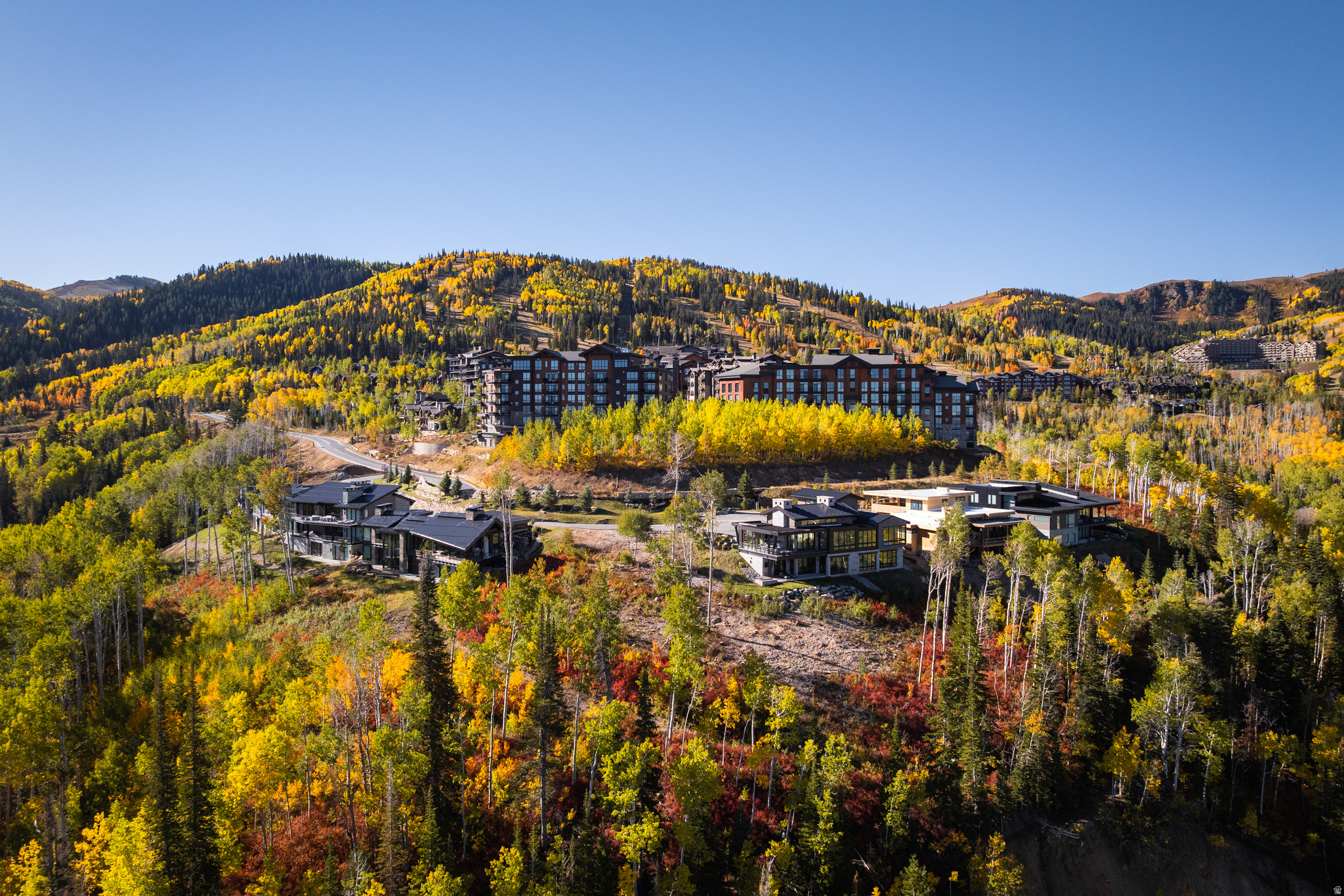 Moonshadow G represents one of the final new-construction, single-family opportunities in Empire Pass, positioned within Deer Valley's most exclusive alpine enclave. What truly sets this residence apart is its commanding west-facing orientation, capturing sweeping views across Deer Valley Resort, Park City Mountain Resort, and the lights of Historic Main Street below-a rare visual corridor that few homes in Empire Pass can offer. Designed in a refined mountain-modern aesthetic, the home balances architectural presence with livability. Expansive walls of glass frame sunsets, ski runs, and Old Town vistas while filling the interiors with natural light throughout the day. Open-concept living spaces flow seamlessly to heated outdoor decks, creating an effortless connection between interior comfort and alpine surroundings in every season. Located in the Moonshadow neighborhood of Empire Pass, ownership delivers immediate proximity to Deer Valley's ski access, Silver Lake Village, and Upper Deer Valley amenities, while remaining just minutes from Main Street Park City-a rare combination of altitude, access, and visibility. Membership for Talisker Club is included and further elevates the offering, providing access to the private Tower Club, spa, dining, fitness, and the Mark O'Mearadesigned golf course at Tuhaye. Moonshadow G is not simply another luxury residence-it is a finite opportunity to own new construction with iconic westward views in a neighborhood where future supply is effectively exhausted.