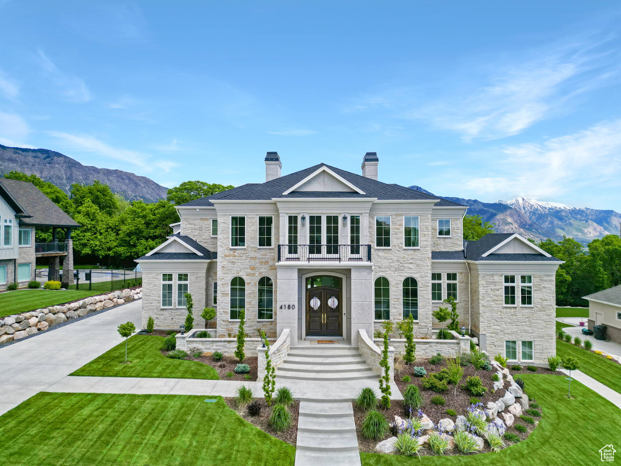 Exquisite Luxury Awaits! Nestled in the heart of Pleasant View's Alder Creek, this breathtaking custom home is the pinnacle of elegance and comfort. From the moment you arrive, the striking real cut limestone and presidential shingles sets the tone for the grandeur within. Step inside and be captivated by the curved two-story staircase with marble flooring, a masterpiece of craftsmanship, while the open formal dining room create an inviting yet sophisticated ambiance. The heart of the home is the expansive kitchen and gathering room. The gourmet kitchen is a culinary pleasure, complete with Thermador refrigerator, Bosch dishwasher and a gorgeous ILVE range. Quartz countertops, an oversized island & a butler pantry also add to the perfection this kitchen offers. The primary suite is a haven of tranquility with spa-inspired features and double oversized custom closet. The home includes plenty of space and multiple living areas.  Upstairs you'll be greeted by a large loft that overlooks the entryway with plenty of windows and natural light.  Two of the three upper bedrooms have access to the upper deck. The third bedroom has its own private bathroom. There is also an additional bathroom and den. Downstairs offers an inviting space for entertainment and additional living with a large family room, kitchenette, three additional bedrooms, plenty of storage and lets not forget about the spray tan room.  The garage fits four cars and has its own private access space above. Perfect for an office, theater, or "cave.' The flat, spacious backyard provides a perfect setting for outdoor enjoyment. The yard can accommodate a pool with ample space for lounging and entertaining. For added convenience a Generac generator is included.  Every detail reflects superior craftsmanship and timeless elegance. Don't miss this rare opportunity to own a masterpiece!