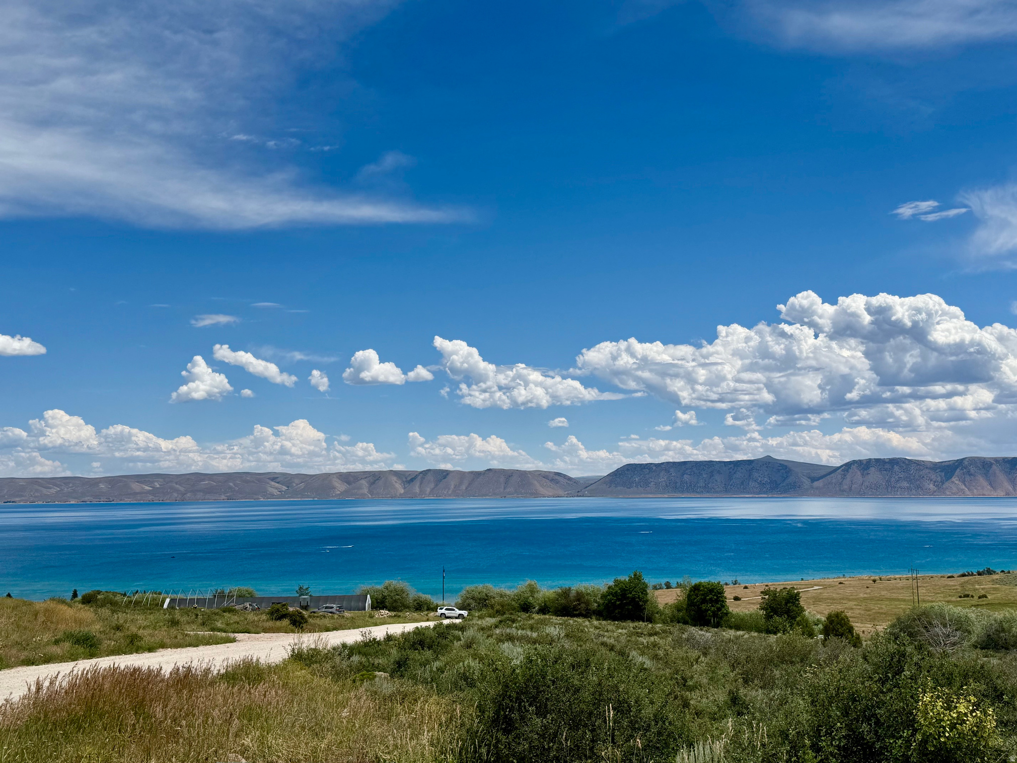Can you imagine!  Your very own 10-ACRES with a panoramic VIEW of beautiful BEAR LAKE and Mountains!  All natural vegetation, untouched for years, on gentle south-facing slope.  With the CANAL running through, there's WILDLIFE galore.  Quiet and private, amazing setting with year-round access.  Build your dream home, with power in the road, you only need well and septic.  Lot cannot be subdivided.