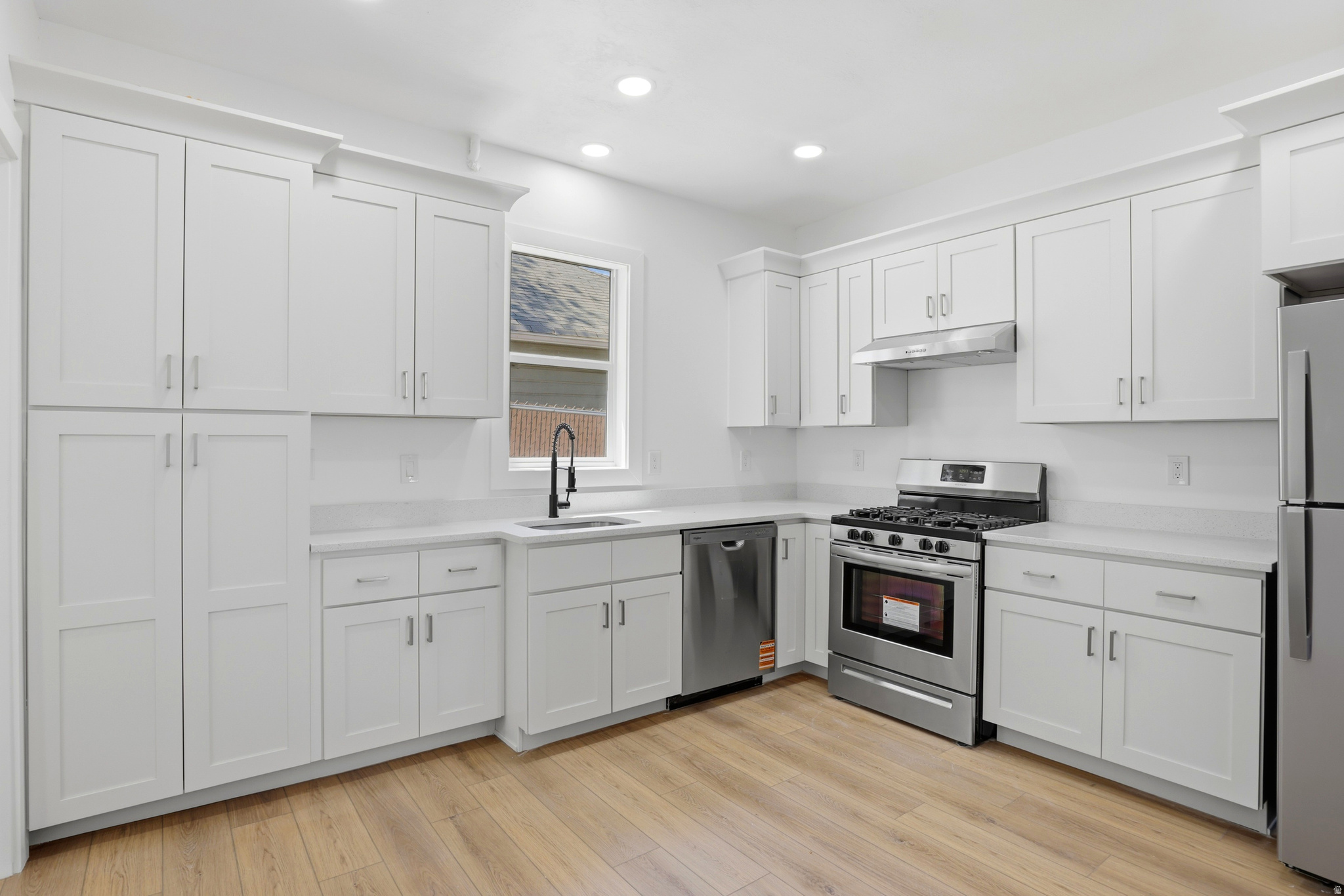 Beautifully renovated bungalow in one of Salt Lake City's most sought-after neighborhoods-just minutes from 9th & 9th, the University of Utah, and Rice-Eccles Stadium. Inside, you'll find brand-new flooring throughout, a stunning new kitchen with quartz countertops, stainless steel appliances, and a gas range, plus new windows and an updated bathroom filled with modern charm. Beyond the beautiful finishes, the foundation has been professionally reinforced by BaseCo and includes a 20+ year transferable warranty for added peace of mind. Move-in ready, perfectly located, and packed with upgrades-come see this one for yourself before it's gone. Square footage figures are provided as a courtesy estimate only and were obtained from county.  Buyer is advised to obtain an independent measurement.