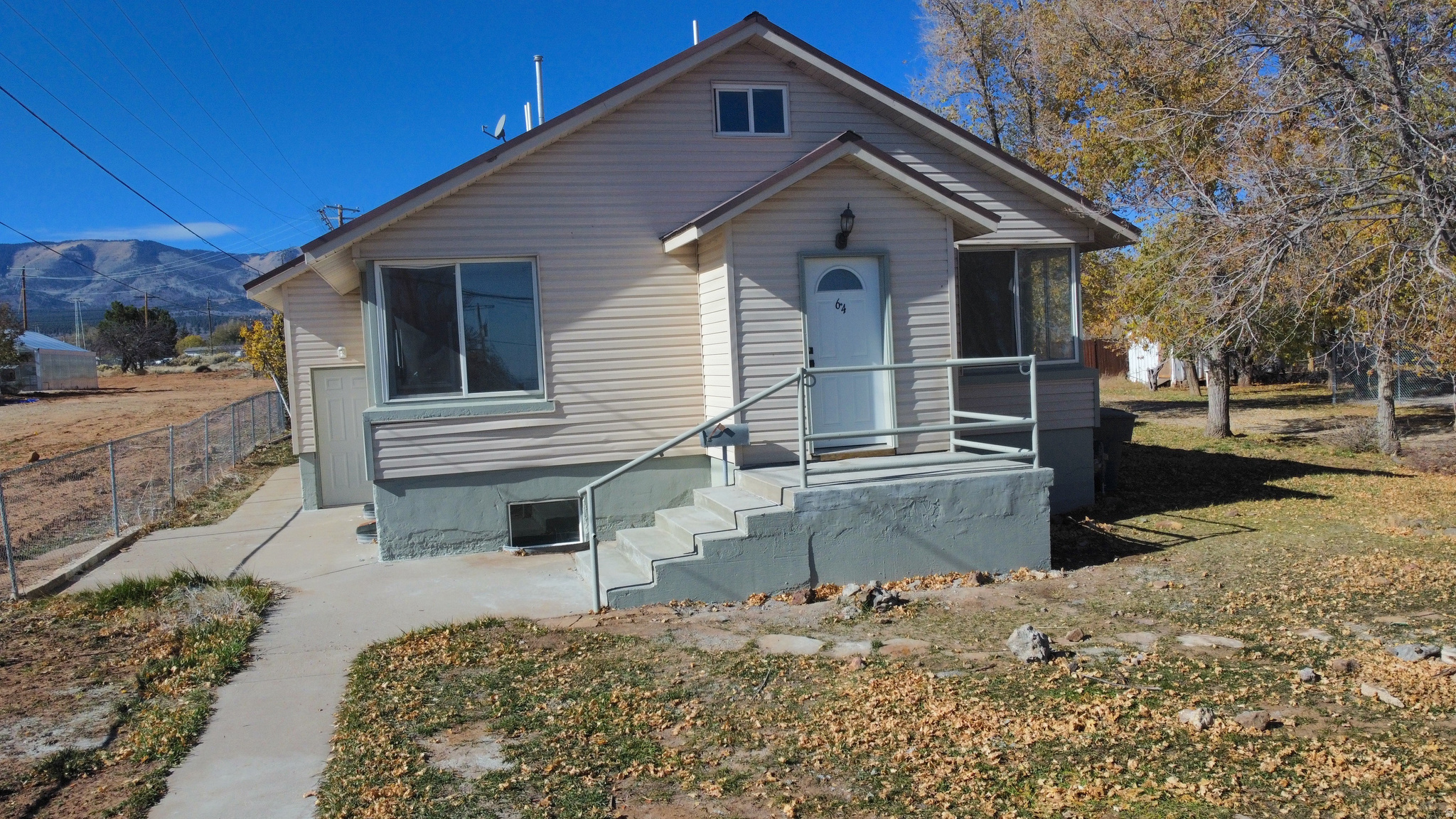 Charming bungalow with modern updates throughout! The best of old style and charm mixed with modern open sized family and living rooms.  Enjoy a fully refreshed interior that's move-in ready and built to last for years to come. The location couldn't be more convenient - just steps from the high school, a short walk to the elementary school, and only a block from the grocery store. Homes this updated, this roomy, and this affordable are hard to find. Don't miss your chance!  See a full virtual tour here: https://my.matterport.com/show/?m=QZkAWfsueiC  Owner/Agent
