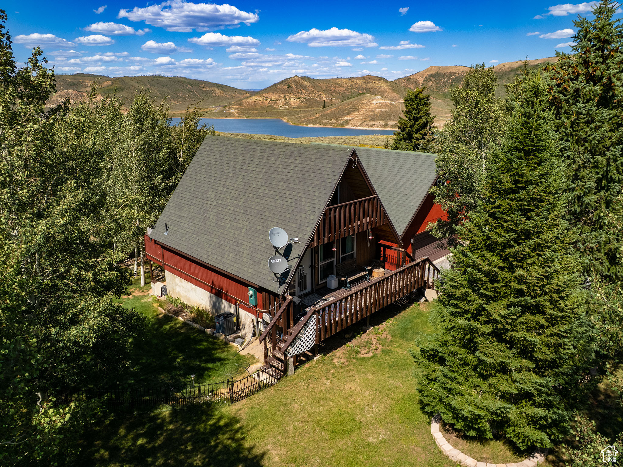 PRICE REDUCED!! * Stunning Cabin looking over Soldier Creek Strawberry Reservoir!! * Beautiful Views of the lake right from your back yard!! * You'll fall in love with this updated 2 bed 2 bath cabin with Year-Round Access (with snowcat) in Soldier Creek Estates * Home has all you need for year-round living with private water, power & septic in a gated private community * Very cozy living room with a fancy wood burning stove, beautiful wood finishes & vaulted ceilings * Updated kitchen featuring knotty-alder cabinets, butcher block counters, newer stainless steel appliances & gas or electric stove! * Newer hardwood & laminate flooring * Newer remodeled bathroom with comfortable clawfoot tub * All electric heat & newer central AC * Upstairs has a loft bedroom with nice space * Downstairs has a master bedroom, bathroom & walk-in closet with laundry room & storage room with freezer included * Downstairs french doors leading to nice patio & hangout area with many tall, mature trees and peace & quiet, fresh mountain air & a firepit * Large detached garage with loft above for possible living space & space-heaters/electric installed - garage also has 2 doors to open from either side * Located near the end of a could-e-sac with AMAZING views of the lake & a water hydrant for safety * Come enjoy living the dream full-time, out of the city where the wildlife roam freely & you can enjoy all your outdoor adventures such as boating, hiking, hunting, fishing, kayaking, 4wheeling & more, right out your back door! * Perfect for a vacation home too! * Located just minutes from Hwy 40, easy access & great location! * BONUS Snowcat & Fishing Boat included if buyers want it. Cabin can come fully furnished if buyer is interested * Buyer to confirm square footage provided by county records.