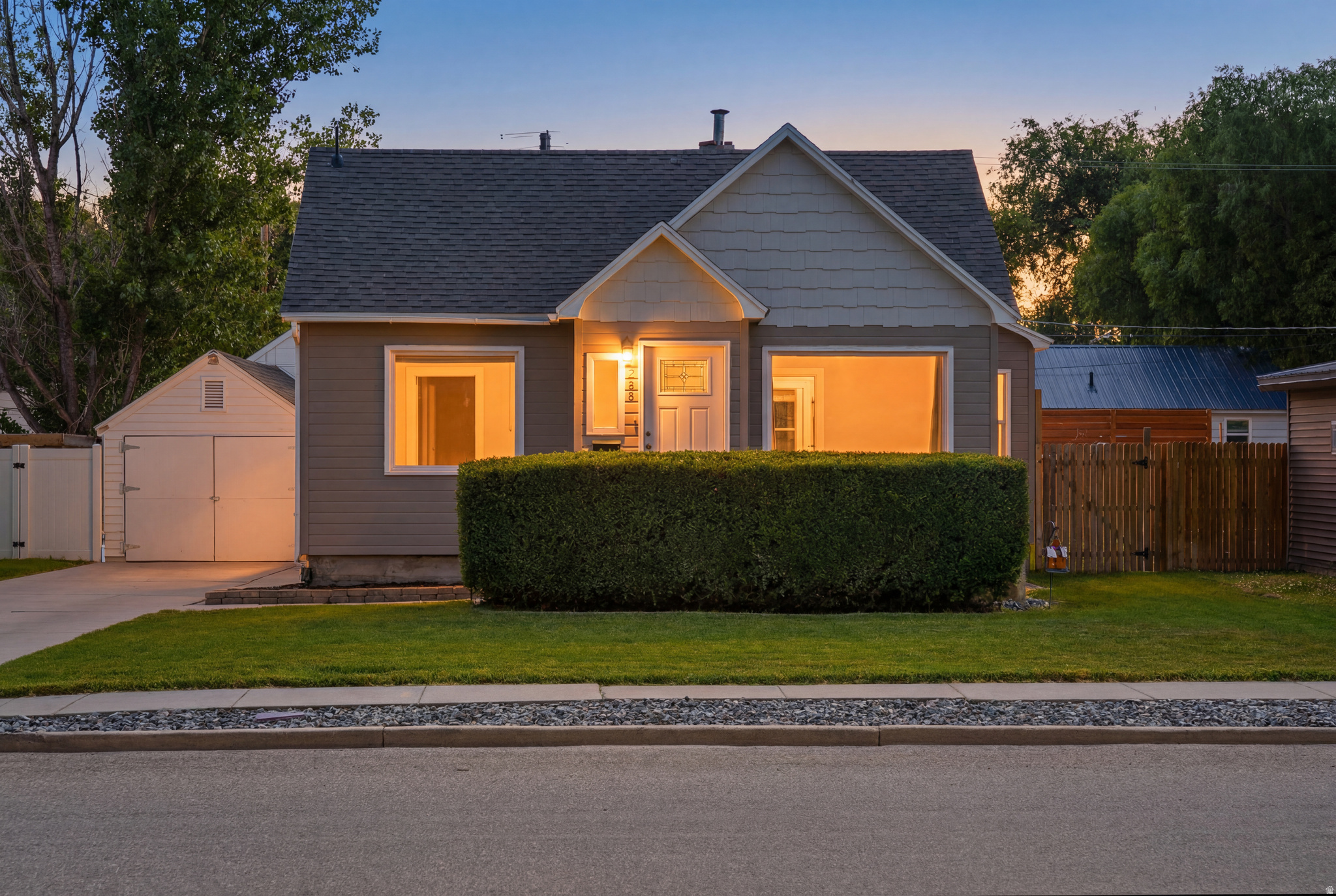 Welcome to one of Tremonton's most charming and move-in-ready homes! This beautifully renovated property has been thoughtfully updated from top to bottom and meticulously maintained, with pride of ownership evident both inside and out. Professionally remodeled in 2020, the home features major upgrades including new windows, roof, furnace, central air conditioning, a completely renovated kitchen, and an updated bathroom with attractive modern finishes throughout. Recent improvements continue to add value, including a brand-new finished basement, stylish kitchen backsplash, and extensive front and backyard landscaping featuring lush new sod, an automatic sprinkler system, and a backyard gravel patio complete with a firepit-perfect for relaxing or entertaining. Adding even more appeal is the impressive detached shop, offering abundant space for hobbies, storage, projects, or recreational vehicles. Location is everything, and this home delivers. Situated directly across the street from a beautiful 2.5-acre community park, you'll enjoy immediate access to open space, a playground, splash pad, and the local library-all just steps from your front door. Whether you're searching for an affordable primary residence, a turnkey rental property, or simply one of the most well-maintained homes in the area, this property offers exceptional value and lifestyle. Homes this well cared for rarely become available. This home is easy to see and appreciate in person. Schedule your private showing today before this Tremonton gem is gone! Buyer/Agent to verify all.