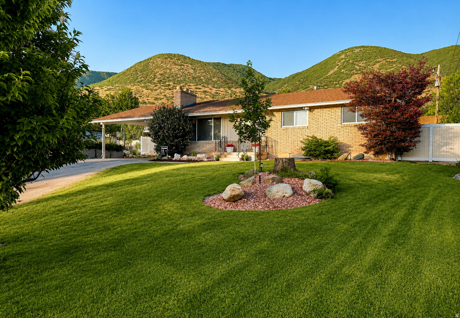 Nestled in one of East Centerville's most desirable neighborhoods, this beautifully maintained brick rambler offers an exceptional combination of privacy, breathtaking mountain views, and an outdoor lifestyle that's difficult to find. Set on a large, professionally landscaped lot, the backyard is a true sanctuary. A peaceful year-round stream borders the property, creating a tranquil setting you'll enjoy.  Beautiful vinyl fencing surrounds the yard, while fruit trees, a garden area, lush landscaping, and expansive green space provide endless opportunities for entertaining, gardening, and making lifelong memories.  Inside, oversized windows fill the home with natural light and frame the incredible mountain views. The kitchen, dining, and family room create a warm gathering place for family and friends, while the spacious primary suite overlooks the private backyard retreat.  Lovingly cared for by the same owner for nearly 40 years, this home offers over 2,600 square feet with 4 bedrooms, 2.75 bathrooms, a large basement family room, generous storage & bonus storage room. The location is just as impressive as the home itself. Step outside and enjoy quick access to hiking and biking trails, with a trailhead only a few blocks away. Costco, grocery stores, restaurants, and shopping are just minutes from your front door. Spend the day at Lagoon, only 10 minutes away, or be on the slopes at Snowbasin, Brighton, Alta, or Solitude in approximately 40 minutes. Whether you're looking for peaceful mornings by the stream, afternoons on the trails, evenings taking in spectacular mountain sunsets, or easy access to everything Northern Utah has to offer, this home delivers a lifestyle that's truly second to none.  Square footage figures are provided as a courtesy estimate only and were obtained from county records .  Buyer is advised to obtain an independent measurement.