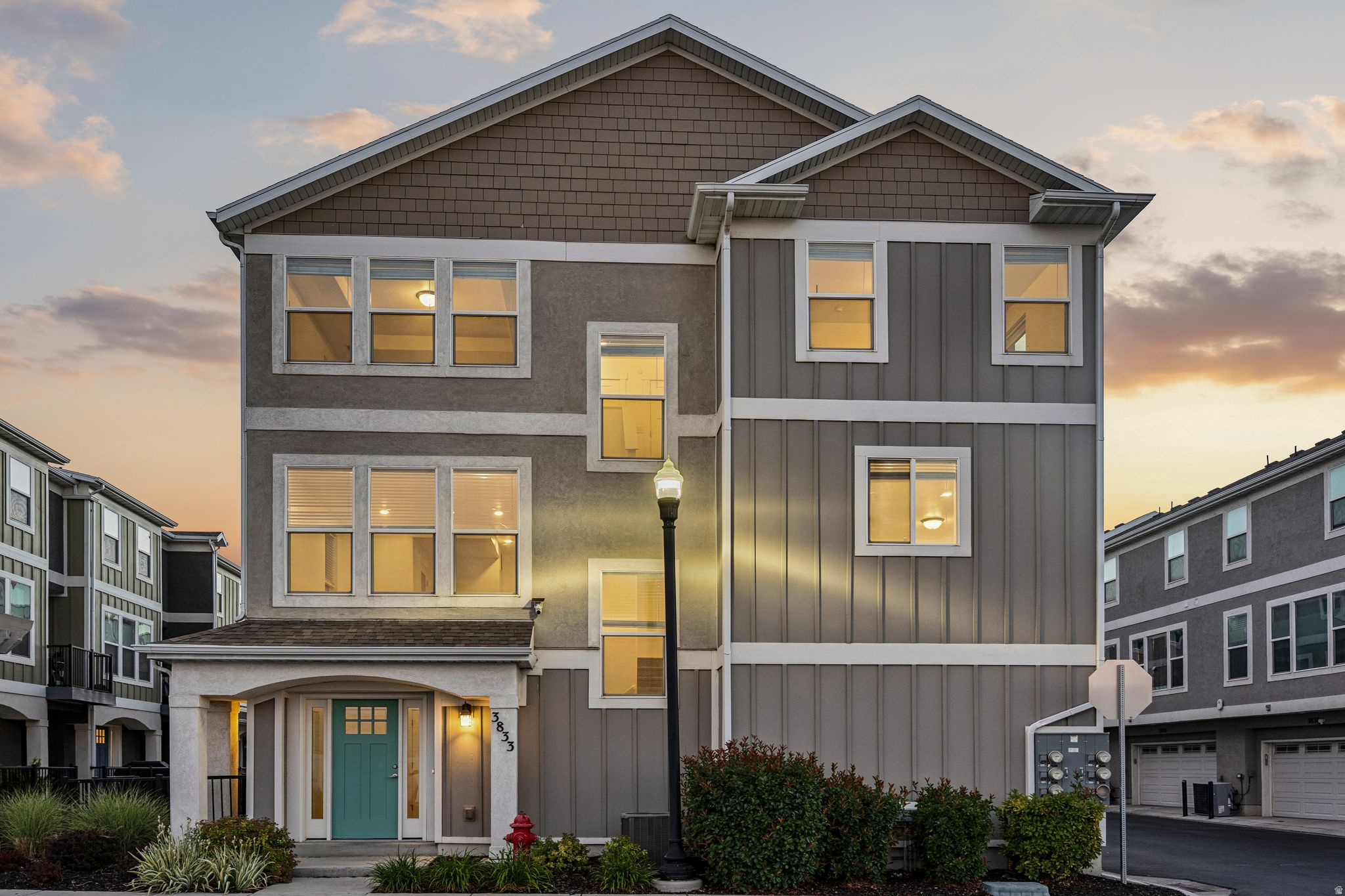 Rare end-unit townhome in Taylorsville's desirable Muirhouse community with stunning 180-degree Wasatch Mountain views from nearly every window. This east-facing home is filled with natural light and features brand-new paint and carpet throughout, LVP flooring in the main living areas, and quartz countertops throughout. Enjoy both a spacious ground-level patio and a private balcony off the living and dining area. The oversized garage offers ample room for storage, a workshop, or outdoor gear. Conveniently located just minutes from Bangerter Highway and only 15 minutes from Salt Lake City International Airport, this home combines comfort, convenience, and incredible views.
