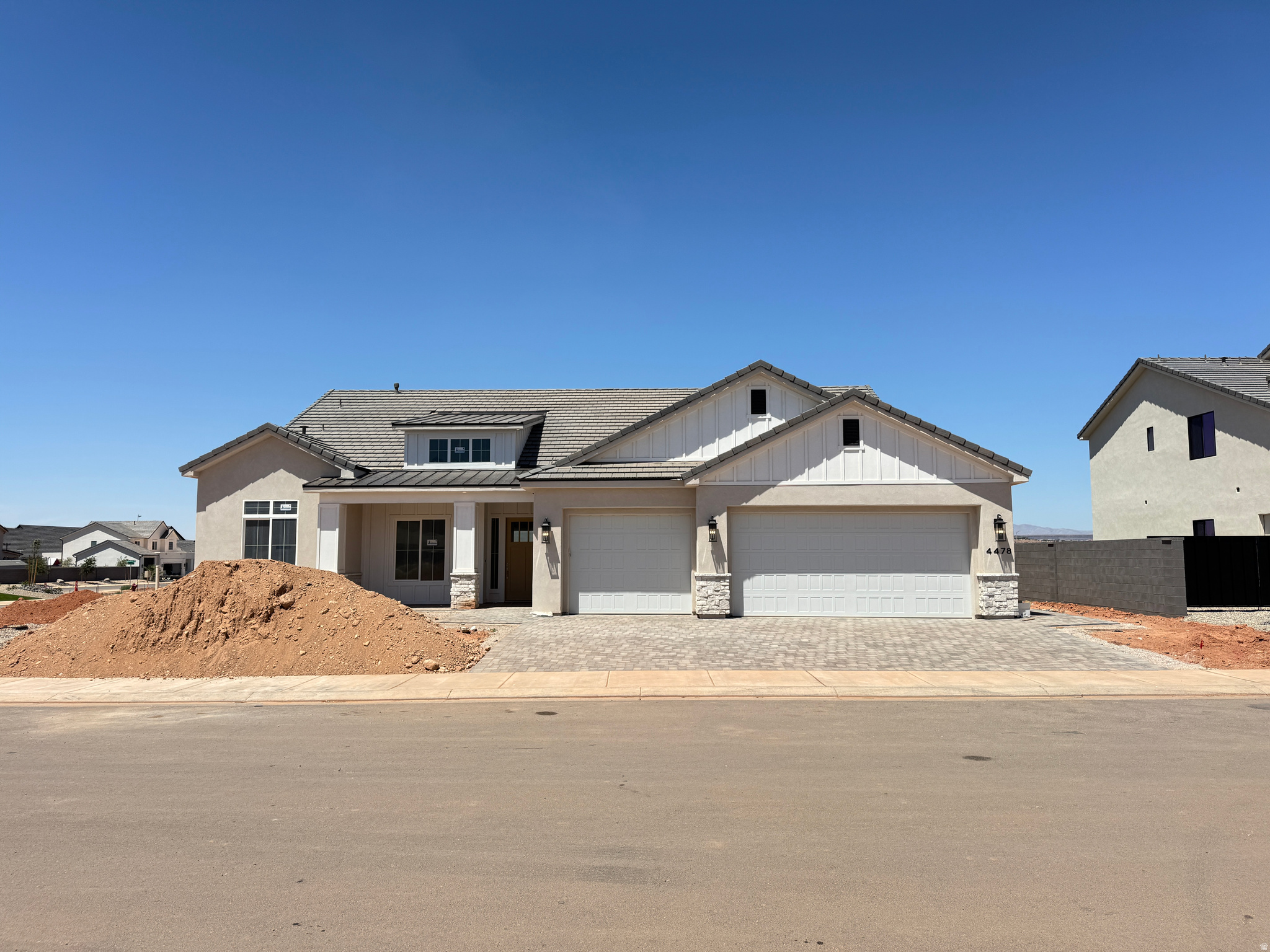 Stunning home in the highly desirable Finley Farms neighborhood, situated on a premium corner lot with an exceptional floor plan designed for comfortable living and entertaining. Oversized picture windows fill the home with natural light, while a large sliding glass door seamlessly connects the living room to the outdoor living space. The chef's kitchen features custom cabinetry, a walk-in pantry, and side-by-side refrigerator and freezer units. Offering a hard-to-find layout with 4 bedrooms, a dedicated office, and a second family room, this home provides ample space for every lifestyle. The luxurious primary suite includes a spa-like bathroom with a double walk-in shower and an expansive walk-in closet. Enjoy an extremely private backyard with no rear neighbors, along with low-maintenance landscaping featuring artificial turf, automatic irrigation for plants, and beautifully finished paver patios and driveway. Hardwood flooring, custom cabinetry, and high-end finishes throughout complete this exceptional home that combines elegance, comfort, and privacy.