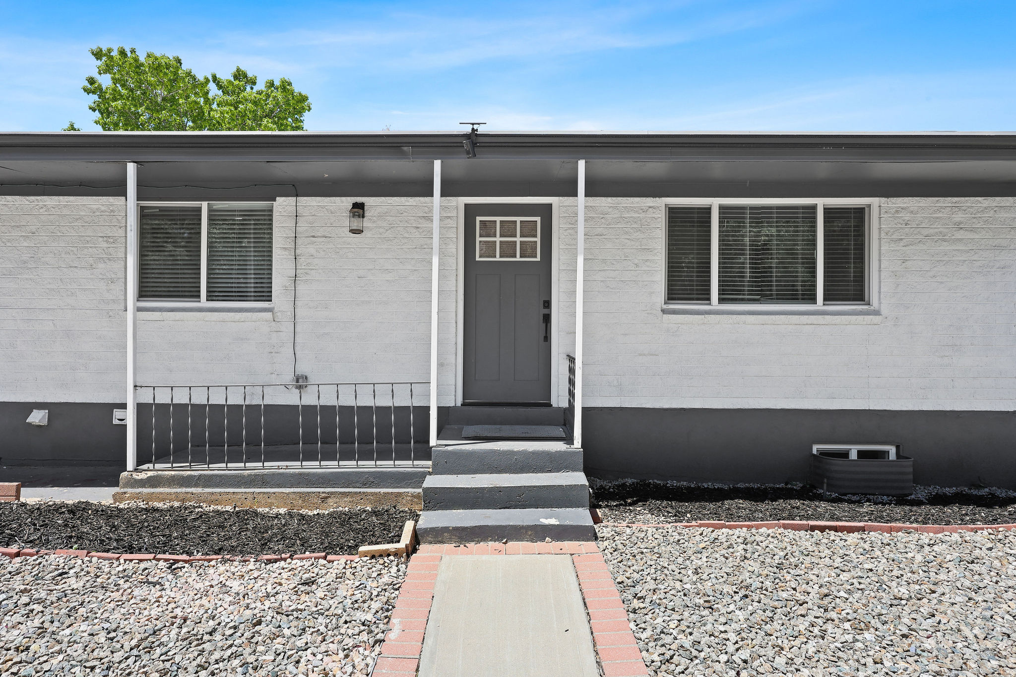 This beautiful rambler has been thoughtfully updated from top to bottom and offers a full walk-out mother-in-law basement-perfect for multi-generational living or potential rental income to help offset your mortgage. Inside, you'll find two stunning new kitchens featuring shaker cabinetry, quartz countertops, stainless steel appliances, stylish backsplashes, and modern finishes throughout. Premium waterproof LVP flooring flows through the main living areas, complemented by high-density carpet in the bedrooms and fresh interior paint throughout the home. Every bathroom has been tastefully updated with designer tile surrounds, modern vanities, and upgraded fixtures. Additional interior improvements include all-new craftsman-style doors, updated base and case trim, modern hardware, new exterior doors, and a beautiful double-swing French door leading from the basement walk-out. Major system upgrades provide peace of mind, including double-pane vinyl windows, new sewer main line, new roof, new plumbing, updated electrical with energy-efficient LED lighting, new outlets and switches, and a brand-new AC unit. Exterior enhancements include designer two-tone paint and seamless gutters surrounding the entire home. The spacious primary suite on the main level features a luxurious en-suite bathroom with a stunning tiled shower, double vanity, and separate walk-in closet. Separate laundry hookups are located both upstairs and downstairs, with basement laundry machines included. The tar and gravel roof has plenty of remaining life. Situated on a deep, oversized backyard, this home is ideally located near mountain access, hiking trailheads, local parks, Ogden Business Depot (BDO), and just minutes from Historic 25th Street dining and nightlife. World-class ski resorts are also within approximately 30 minutes, making this an exceptional opportunity to enjoy both convenience and outdoor recreation.   Square footage figures are provided as a courtesy estimate only, buyers to verify.
