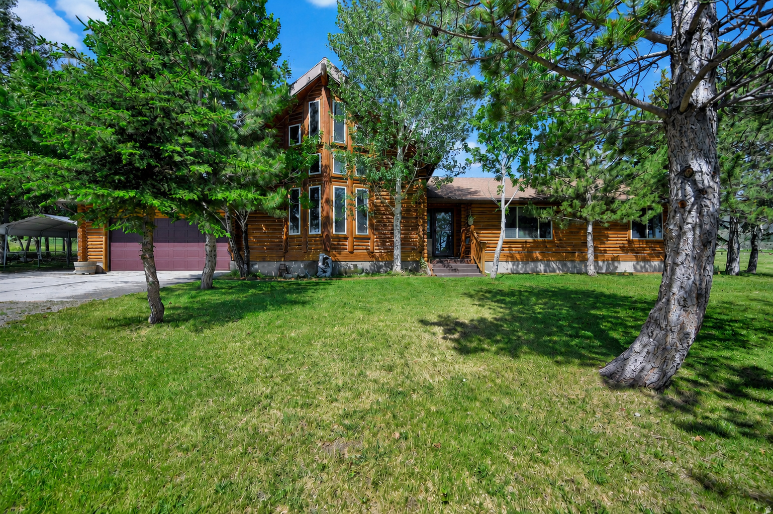 Whether you're searching for a full-time residence, a family getaway, or a mountain retreat to enjoy for generations, 71 Deer Creek Lane offers a rare opportunity to own your own slice of Idaho paradise. Nestled on 5 beautiful acres near Malad and surrounded by the natural beauty of Southern Idaho, this inviting log home offers the perfect balance of comfort, privacy, and adventure. Imagine waking up to fresh mountain air, enjoying coffee on the porch as wildlife passes through, and ending your evenings beneath a sky full of stars. Thoughtfully maintained and updated, the home features a recently remodeled kitchen, professionally chinked logs, a new furnace, and central air conditioning, providing modern comfort while preserving the warmth and character that make log homes so special. Throughout the home, unique custom touches showcase the craftsmanship and personality of the property, including hand-carved chainsaw bears incorporated into the banister, a stunning hand-carved mantel, and impressive antler chandeliers that perfectly complement the mountain-lodge atmosphere. Beyond the main cabin, a separate guest cabin offers incredible flexibility. Finish it as a guest house for family and friends, create a private studio or workspace, or explore its potential as a short-term rental for additional income. With easy access to nearby national forest land, there is no shortage of opportunities for hiking, ATV riding, hunting, horseback riding, snowmobiling, or simply enjoying the peace and quiet of country living. Yet the property remains comfortable and practical enough for year-round living. Permanent exterior holiday lighting makes it easy to celebrate every season, adding warmth and charm to the property year-round. This is more than a home. It's a place where holidays become traditions, weekends turn into adventures, and everyday life feels just a little more connected to the things that matter most. Whether you're seeking a private mountain escape, a full-time residence with room to roam, or a property where lasting memories are made, 71 Deer Creek Lane offers a lifestyle that is becoming increasingly difficult to find.