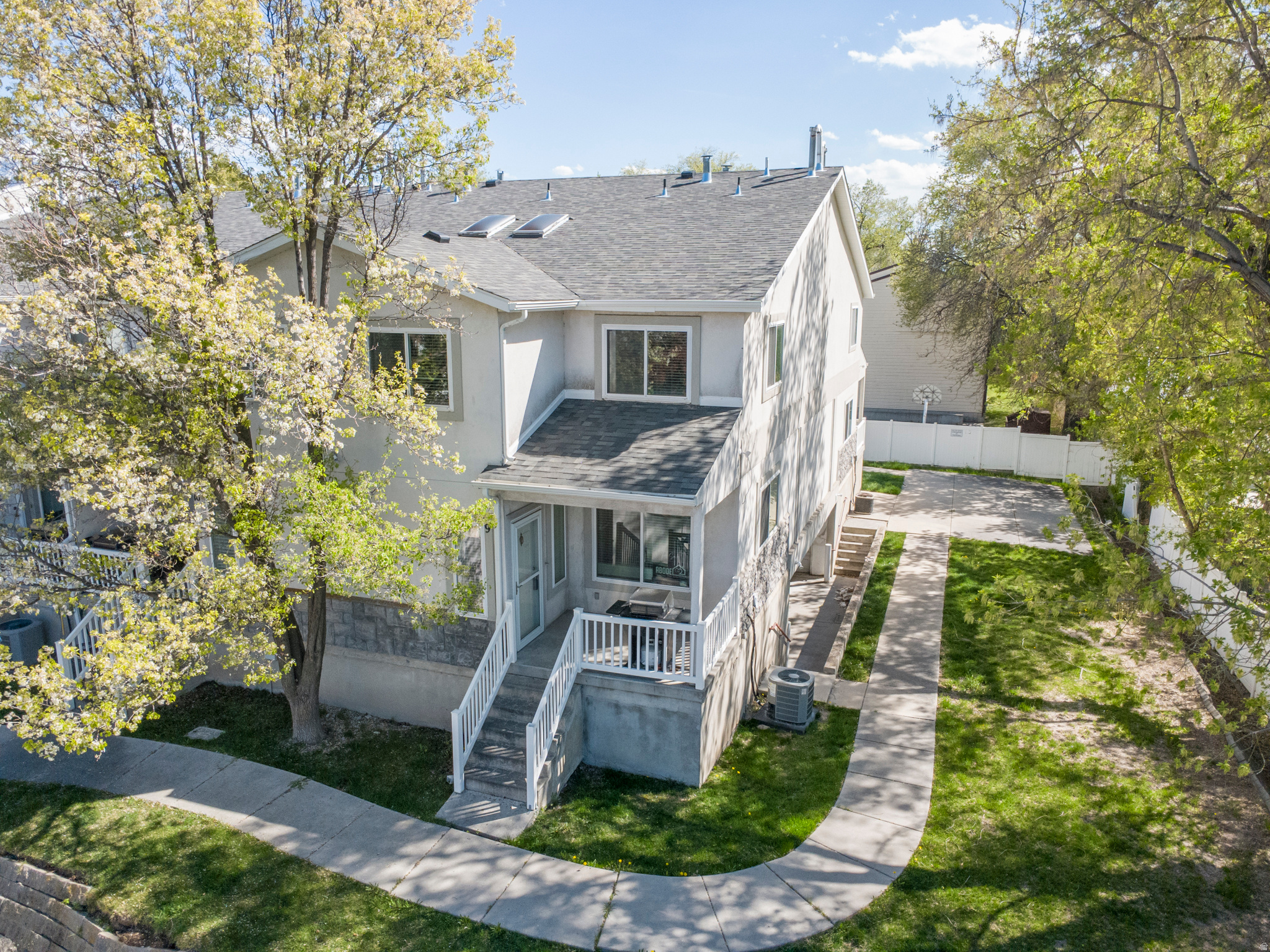 This private, bright and spacious end-unit townhouse is perfectly positioned at the back of one of Millcreek's most conveniently located neighborhoods. This thoughtfully designed home features 2 bedrooms, 2.5 bathrooms, and an attached 2-car garage, and all appliances included - offering the convenience and comfort today's buyers seek in a low-maintenance lifestyle. Step inside to discover a light-filled floor plan with vaulted ceilings, generous living spaces, and modern finishes throughout. The well-appointed kitchen boasts plenty of cabinet and counter space - ideal for both everyday meals and entertaining guests. Upstairs, the expansive primary suite features vaulted ceilings, a large walk-in closet, and a private ensuite bathroom, while the second bedroom also offers its own full bathroom. A conveniently located half bath on the main level completes the thoughtful layout. As an end unit, this home enjoys added privacy and extra natural light - plus a private two-car garage right off the lower level for easy access and storage. Situated just minutes from major freeways, this home offers effortless commuting to downtown Salt Lake City, Sugar House, and surrounding employment hubs. Enjoy quick access to everyday essentials, grocery stores, and a variety of dining and shopping options. Outdoor enthusiasts will love being near scenic recreational spots - including the expansive trails and beauty of Millcreek Canyon for hiking and biking, and Big Cottonwood Regional Park with playgrounds, walking paths, and open green space for year-round enjoyment. For social and community experiences, Millcreek Common offers skating, seasonal markets, events, and gathering spaces just a short drive away. Whether you're a first-time buyer, downsizing, or seeking a smart investment opportunity, this Millcreek townhome delivers comfort, convenience, and access to everything the Salt Lake Valley has to offer. Schedule your showing today - this one won't last long!