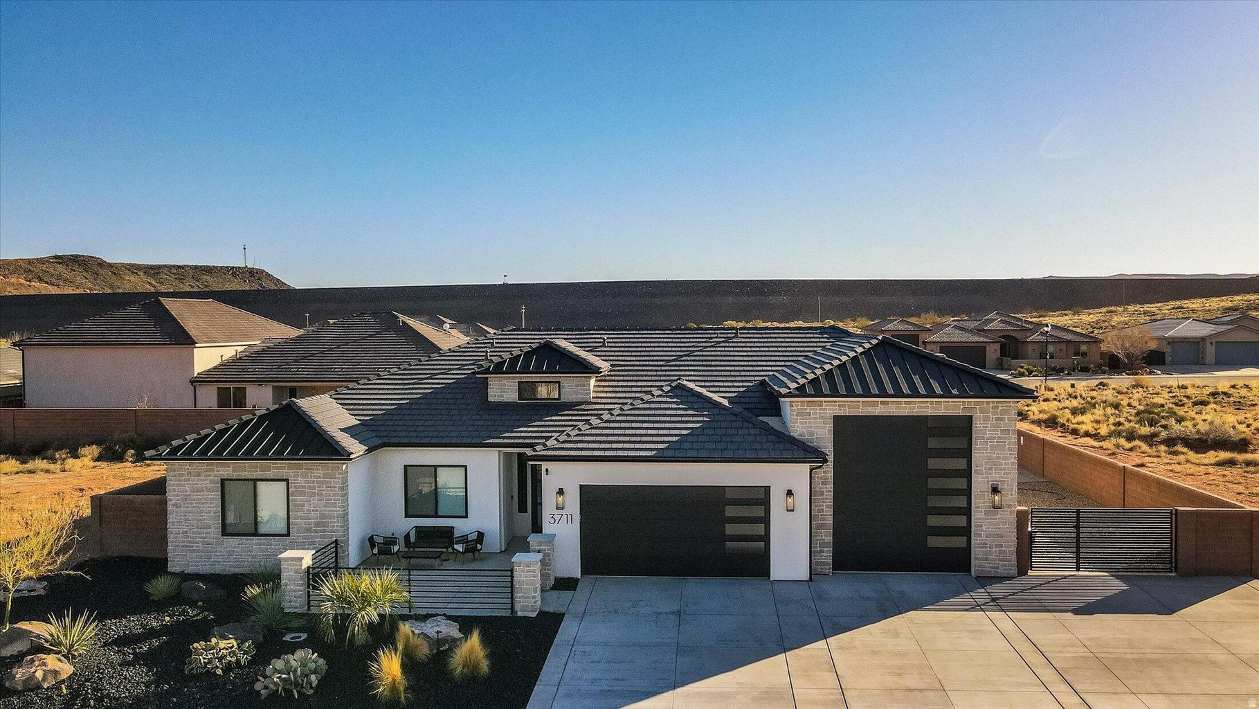 : Welcome to this stunning newer-built home in the highly desirable Dixie Springs community! Built in 2020, this thoughtfully designed residence offers approximately 2,200 sq ft of living space with 4 spacious bedrooms and 2.5 bathrooms, perfectly blending modern comfort with functional living. Step inside to an open-concept floor plan featuring a bright and inviting great room, ideal for entertaining or relaxing. The well appointed kitchen flows seamlessly into the dining and living areas, creating a central gathering space with plenty of natural light. The primary suite offers a private retreat with ample space, while additional bedrooms provide flexibility for guests, a home office, or growing households. Every detail reflects quality craftsmanship and contemporary finishes throughout. Situated in a quiet, well-kept neighborhood, this home sits on a generously sized lot with room to enjoy Southern Utah's outdoor lifestyle. Whether you're taking in the surrounding red rock scenery, hosting gatherings, or simply enjoying the peaceful setting, this property delivers. Located just minutes from Sand Hollow Reservoir, golf courses, hiking trails, and all the amenities of Hurricane and St. George, this home offers the perfect balance of recreation and convenience.