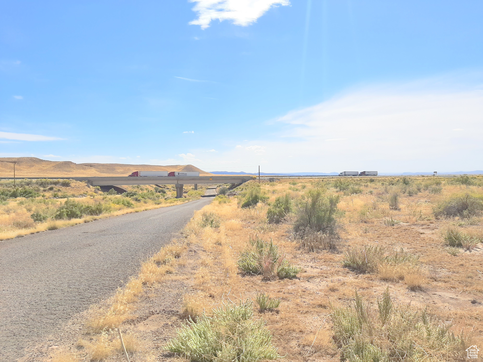 This 80.34 ac. parcel parallels I-70 in the Thompson Springs area. Thompson Springs is 35 miles from Moab, and or if you are heading to Lake Powell it is on your way; it is 2 1/2 hrs. away from Bull Frog Lake Powell. Every weekend vehicles from Denver drive past this property hauling their boats because the Bullfrog and Ticaboo boat storage facilities are full. It is hard on their vehicles driving up the Rocky Mts. using a lot of gasoline and then down the other side wearing out their brakes. This is a great place to build a Lake Powell boat storage area. Customers can leave Denver Friday after work and head over the Rocky Mts. hook up their boat and either stay in Thompson Spring or Green River for the night. Early in the morning just a short trip to Bullfrog and launch your boat while it is still cool in the morning. This property parallels I-70 which make it a perfect place to install Hwy billboards and generate extra income. Please call agent before entering land. Square footage and acreage figures are provided as a courtesy estimate only and were obtained from county records. Buyer is advised to obtain an independent measurement.