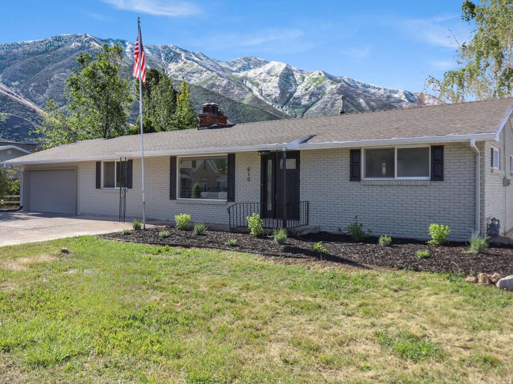 In the heart of sought-after Mapleton, this beautifully remodeled 2,300 sq. ft. brick rambler offers comfort, and breathtaking surroundings. Thoughtfully updated throughout, this 4-bedroom, 2-bath home features modern finishes, creating a warm and inviting atmosphere from the moment you step inside. Enjoy the spacious formal dining room, cozy evenings by one of two fireplaces and relaxing under the covered patio while taking in stunning mountain views with the privacy of having no backyard neighbors!!! living in Mapleton is more than just owning a home, it's embracing a lifestyle. Tucked quietly against the mountains, this niche community is known for its phenomenal views in every direction, peaceful surroundings, scenic walking trails ( easy access Mapleton Parkway Trail ) and beautiful parks. This is a place where tranquility, outdoor beauty, and small town charm meet modern convenience.