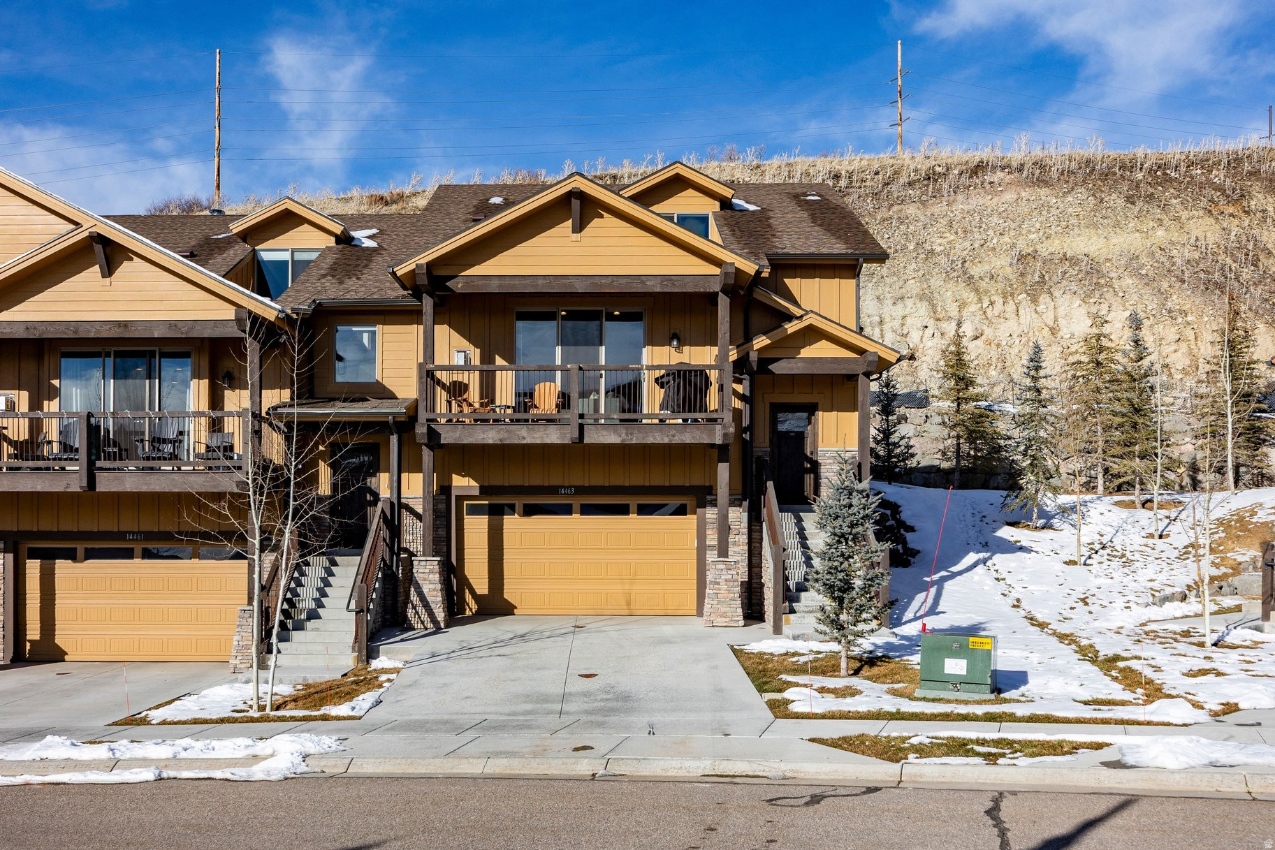 This Black Rock Ridge Townhome stands apart with a thoughtful layout and refined upgrades throughout. Ideally positioned on a south-facing hillside, the home enjoys abundant natural light and a peaceful mountain setting. The residence offers four ensuite bedrooms, including a desirable main-level primary suite, plus an upstairs bedroom currently configured as a spacious bunk room. Expansive living areas include a vaulted great room and a generous lower-level family room-perfect for gathering and entertaining.  Built in 2018, luxury upgrades include Viking appliances, quartz countertops, and wide-plank oak flooring. The home offers a sophisticated yet comfortable mountain retreat. Furnishings are negotiable, making this a turn-key opportunity for the next owner. Perfectly located just minutes from world-class skiing at Deer Valley and Park City, and dining and shopping on Park City's Main Street. A two-car garage completes this exceptional offering, ideal for full-time living or a refined second home.