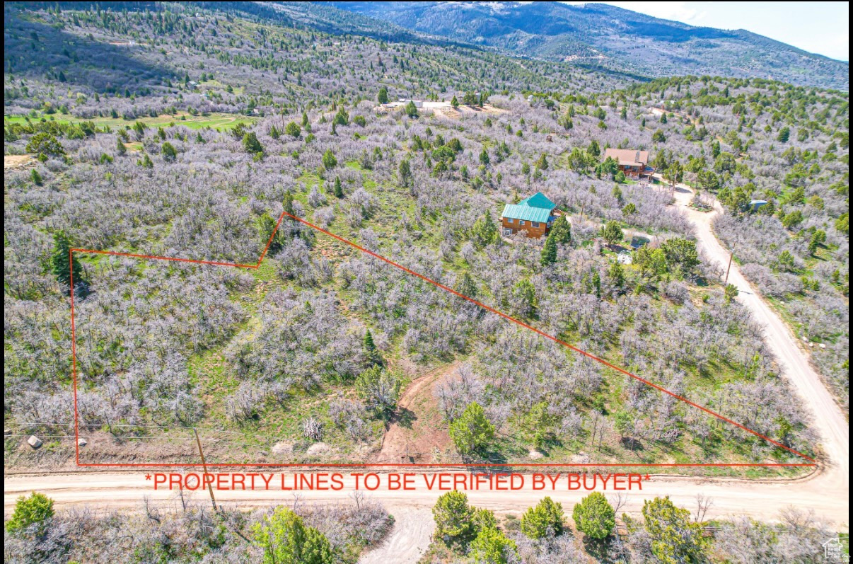 1 acre with 1 water share. Beautiful lot located in a gated community with year around access. Breath taking views, trials, pond and more that are available. The culinary water meter box is on the lot, freeze proof faucet added, rv pad done and Rocky Mountain Power lines are ran along the road out front. Gas would be a propane tank, sewer would be a septic tank and internet is hard wired or broadband wireless but would be added after purchase. Build your dream home or cabin!