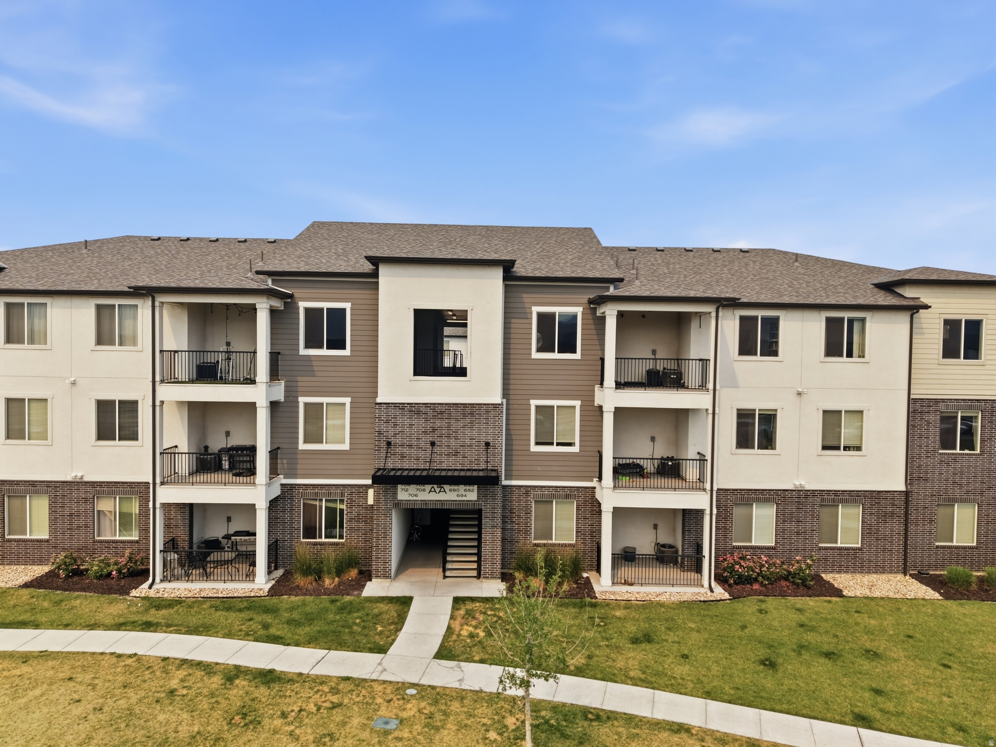 Beautiful third-level condo located in the highly desirable Lake Front Community in Vineyard! This bright and inviting unit features quartz countertops, vaulted ceilings, a spacious primary suite with a walk-in closet, and convenient garage access from the breezeway through a man door. The location is hard to beat, with the lake and nearby trail just on the other side of the neighboring building. Enjoy all the community has to offer, including playgrounds, a swimming pool, pickleball courts, a clubhouse, and a gym. Washer, dryer, and fridge are negotiable. Come see this one before it's gone! **Square footage figures are provided as a courtesy estimate only and were obtained from county records. Buyer is advised to obtain an independent measurement. BUILDING AA