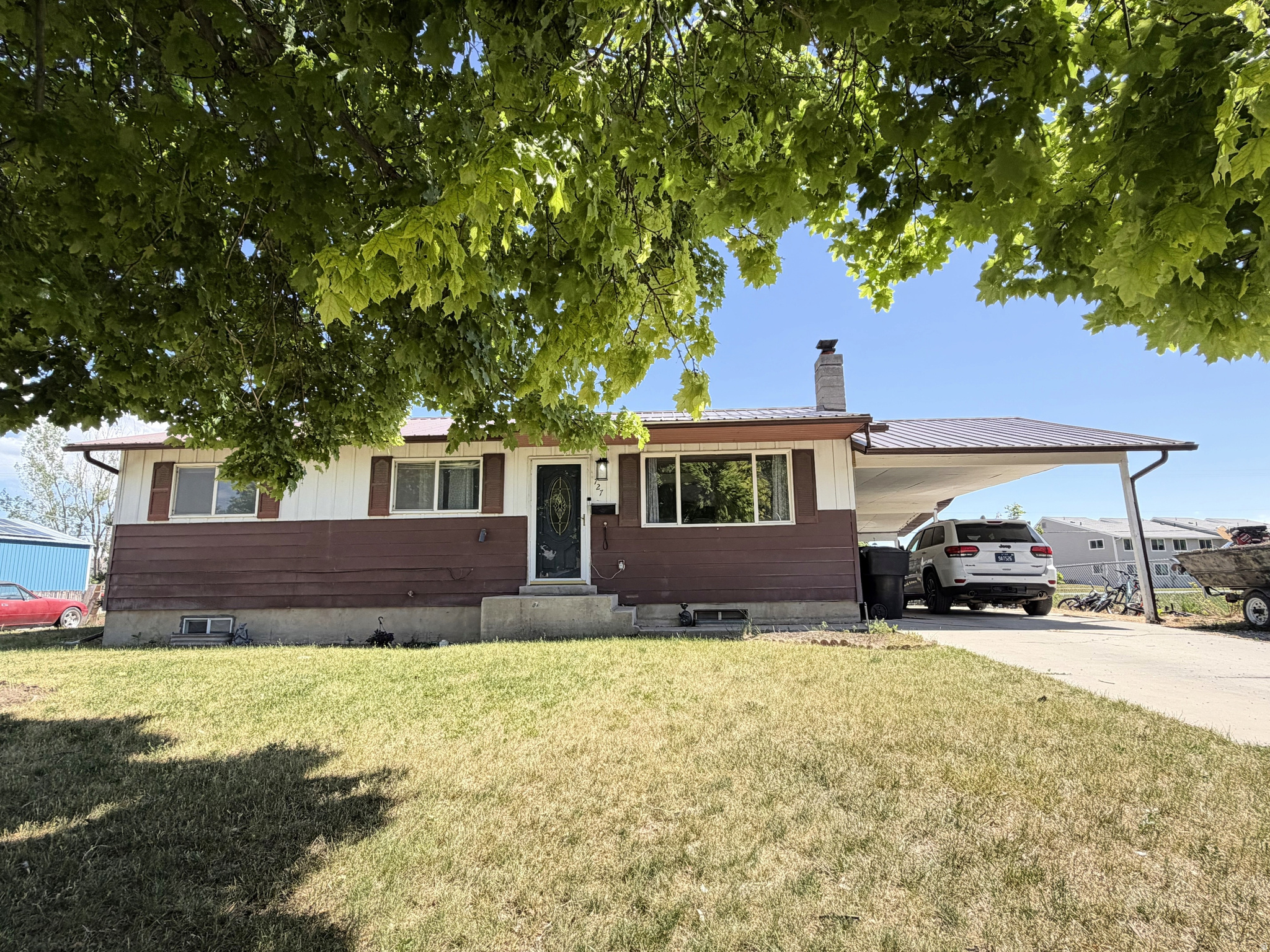 Welcome home to this charming Tremonton starter home! Featuring 4 bedrooms and 1 bathroom, this cozy property offers plenty of space inside and out! Large master bedroom with walk-in closet and the option to add an additional bathroom! Enjoy the convenience of a covered carport and the added bonus of a beautiful, open grassy space right next door, providing extra room to play, relax, and enjoy the outdoors. It is fully fenced and is on a dead-end street! Whether you're a first-time homebuyer, looking to downsize, or searching for an investment opportunity, this home offers comfort, value, and a great location. Don't miss your chance to make this cute Tremonton home your own!