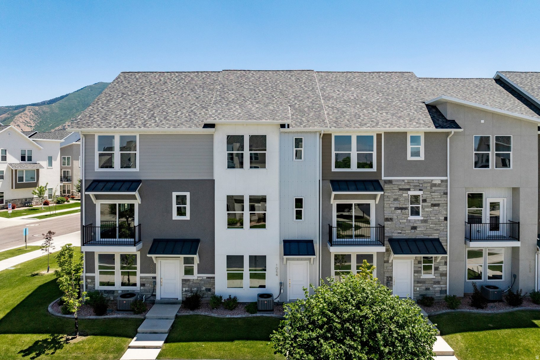 Beautiful three-bedroom townhome at the Ridge at Spanish Fork. This is a three-bedroom Midtown plan that features two ensuite bedrooms, a nice family room, and a large kitchen with a back covered deck. It has a one car attached garage. The Ridge at Spanish Fork is a beautiful townhome community located on the east end of Spanish Fork. The Ridge has a clubhouse with a fitness center, an indoor/outdoor pool, new pickleball courts, and a dog park. The development is conveniently located near shopping (there is a grocery store across the street and Costco is just down the road), restaurants, schools, and only minutes from I-15 and the mouth of Spanish Fork Canyon. The Ridge offers two, three, and four-bedroom floor plans. There is new inventory available and we also work with investors. Come tour the model for more information. Use our preferred lender and receive a $10,000 credit for a rate buydown or closing costs