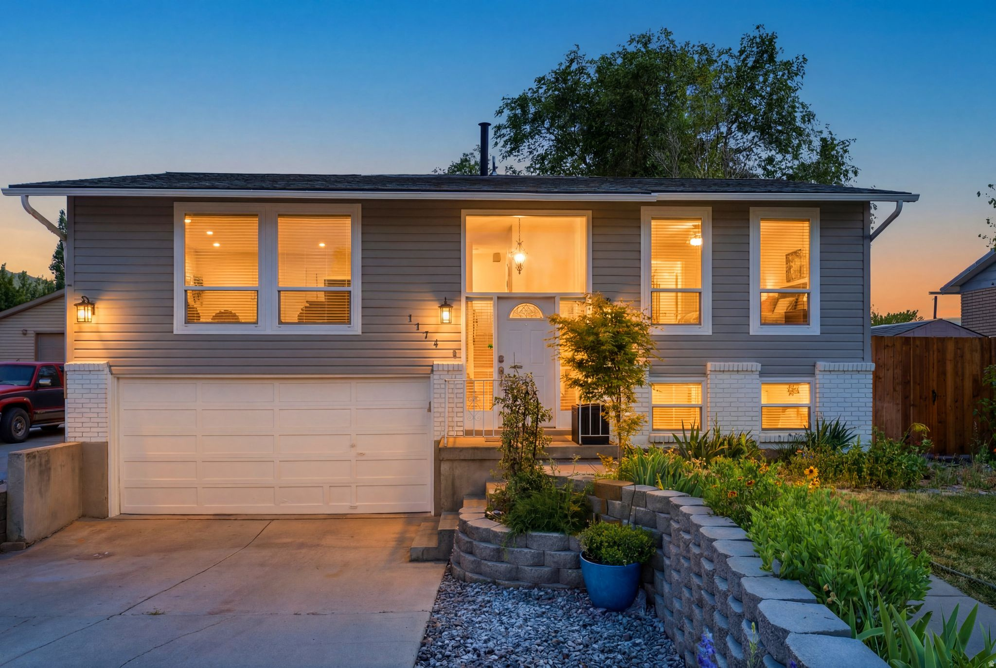 Beautifully updated Sandy home featuring 4 bedrooms, 2.5 bathrooms, RV parking, mountain views, and exceptional outdoor living spaces. The spacious main level offers an open flow between the kitchen, dining, and living areas, highlighted by a cozy gas fireplace and abundant natural light. The kitchen features granite countertops, stainless steel appliances, ample cabinetry, and bar seating.  The primary suite includes a walk-in closet plus additional storage, while the fully finished lower level provides flexible space for bedrooms, a home office, gym, hobbies, or recreation.  Step outside to enjoy the expansive covered deck with ceiling fans and stunning Wasatch Mountain views. The fully fenced backyard offers mature shade trees, a firepit area, swing set, dog run, storage shed, and plenty of room to entertain, play, or relax. The extended RV/boat parking provides space for all your toys.  Major updates include a newer roof, furnace, and water heater. Additional highlights include a large indoor storage/workshop area behind the garage, automatic sprinklers, mature landscaping, and a convenient Sandy location close to parks, shopping, dining, schools, and commuter routes.  Buyer to verify all information, including square footage.