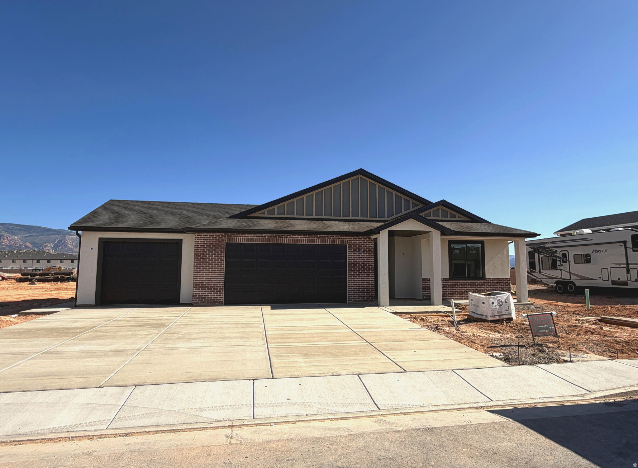 Brand-new single-level living in Cedar City's Iron West community! This 1,802 sq ft home offers 3 beds, 2 baths, and a 3-car garage! The open kitchen, dining, and family room flow together around a cozy gas fireplace, with doors leading to a covered patio for easy indoor-outdoor living. The primary suite features a walk-in closet and private ensuite. Energy-efficient 2x6 construction, R-49 attic insulation, and low-E windows keep utility bills low. Durable brick, stucco, and board & batten exterior means low maintenance for years to come. Perfect for empty nesters wanting to simplify or first-time buyers ready for a low-upkeep, move-in-ready home. Special Financing incentives are offered! Schedule your tour today!