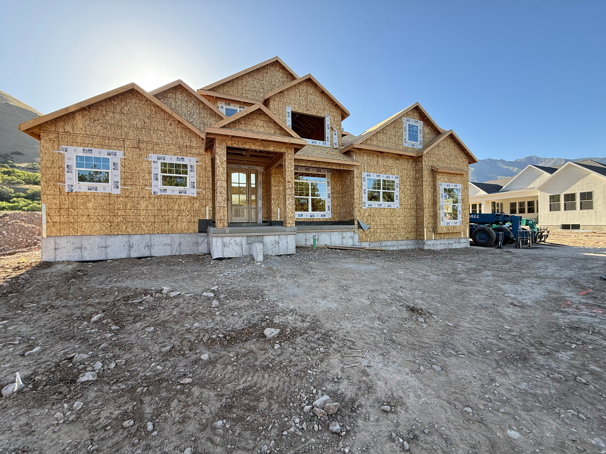Brand new, fully custom construction by Sweetwater Homes, perfectly positioned right at the mouth of Hobble Creek Canyon. Sitting on a premier 0.34-acre lot, this home blends high-end, modern-organic design with unmatched mountain views, with interior curation by the Alika Design team.  The main floor features an incredible kitchen built for entertaining, complete with a massive island, double-wide fridge/freezer combo, and a hidden walk-in pantry. Down the hall, the private master wing serves as a true retreat, featuring a spa-inspired bathroom with a freestanding soaking tub and dual walk-in closets.  Upstairs, a massive loft offers the perfect setup for a secondary family room, game area, or tech center, creating an ideal buffer between the bedrooms. Outside, the front yard landscaping is already included for immediate curb appeal, while the backyard is a clean slate ready for you to customize.  Storage is no issue with the oversized 3-car garage, offering plenty of deep space for vehicles and all your canyon gear-from bikes to skis. Built with signature Sweetwater quality throughout, including custom soft-close cabinetry and premium quartz countertops. Enjoy custom, canyon-side living just minutes from everything Springville has to offer.