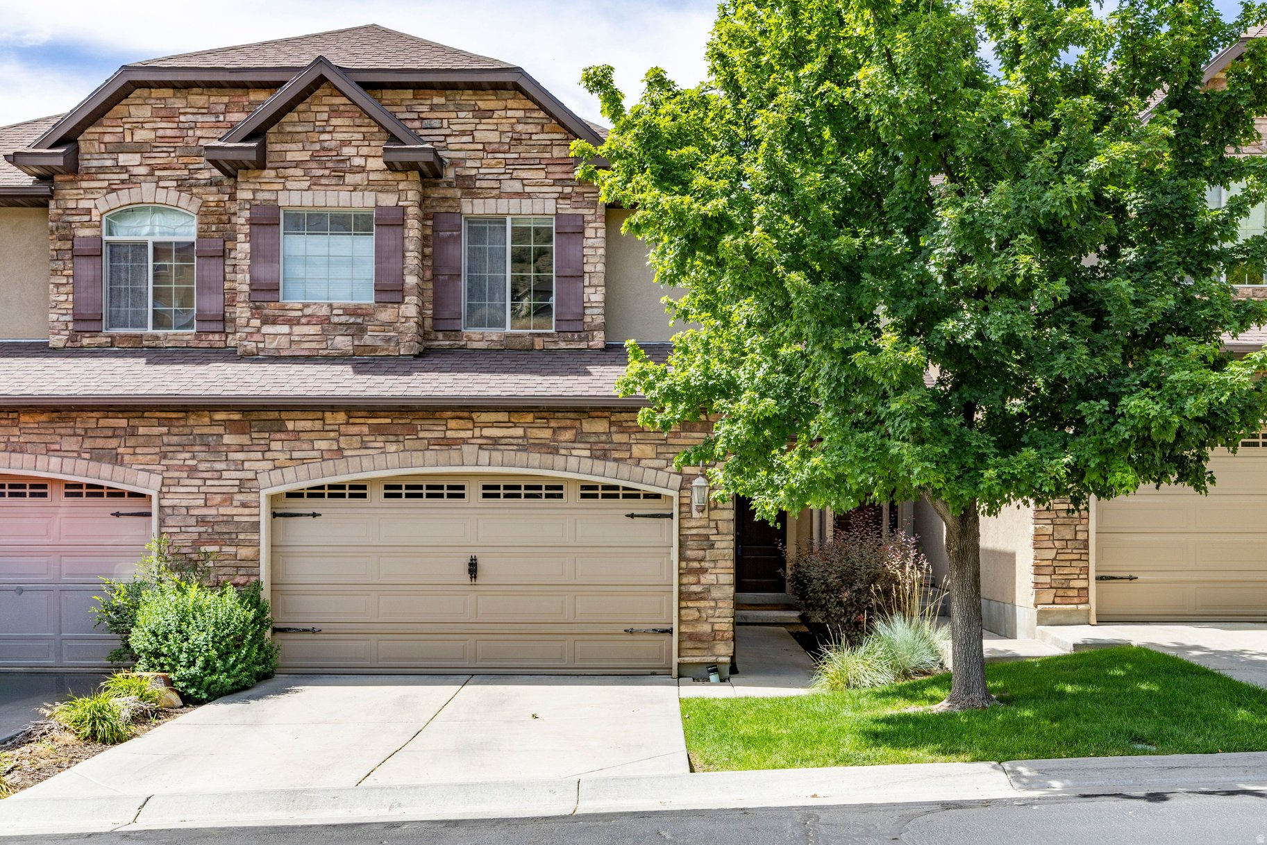 Perched on the Draper Bench with sweeping views of the Wasatch Mountains, valley, and city lights, this beautifully designed 4-bedroom, 3-bathroom townhome offers the perfect blend of comfort, flexibility, and location. The main level welcomes you with an open, light-filled living space and a well-appointed kitchen ideal for both everyday living and entertaining. Upstairs, the spacious primary suite is complemented by two additional bedrooms, freshly painted and carpeted. The fully finished walkout basement is a true bonus, complete with a bedroom, generous family room, and enough flexibility to function as a second primary suite, ideal for guests, in-laws, or added privacy. A 2-car attached garage, vaulted ceilings, granite countertops, gas range, jetted tub, minutes from I-15, Silicon Slopes, top-rated Canyons District schools, world-class skiing at Snowbird, mountain biking from your doorstep, and premier shopping and dining. This is Draper living at its finest.