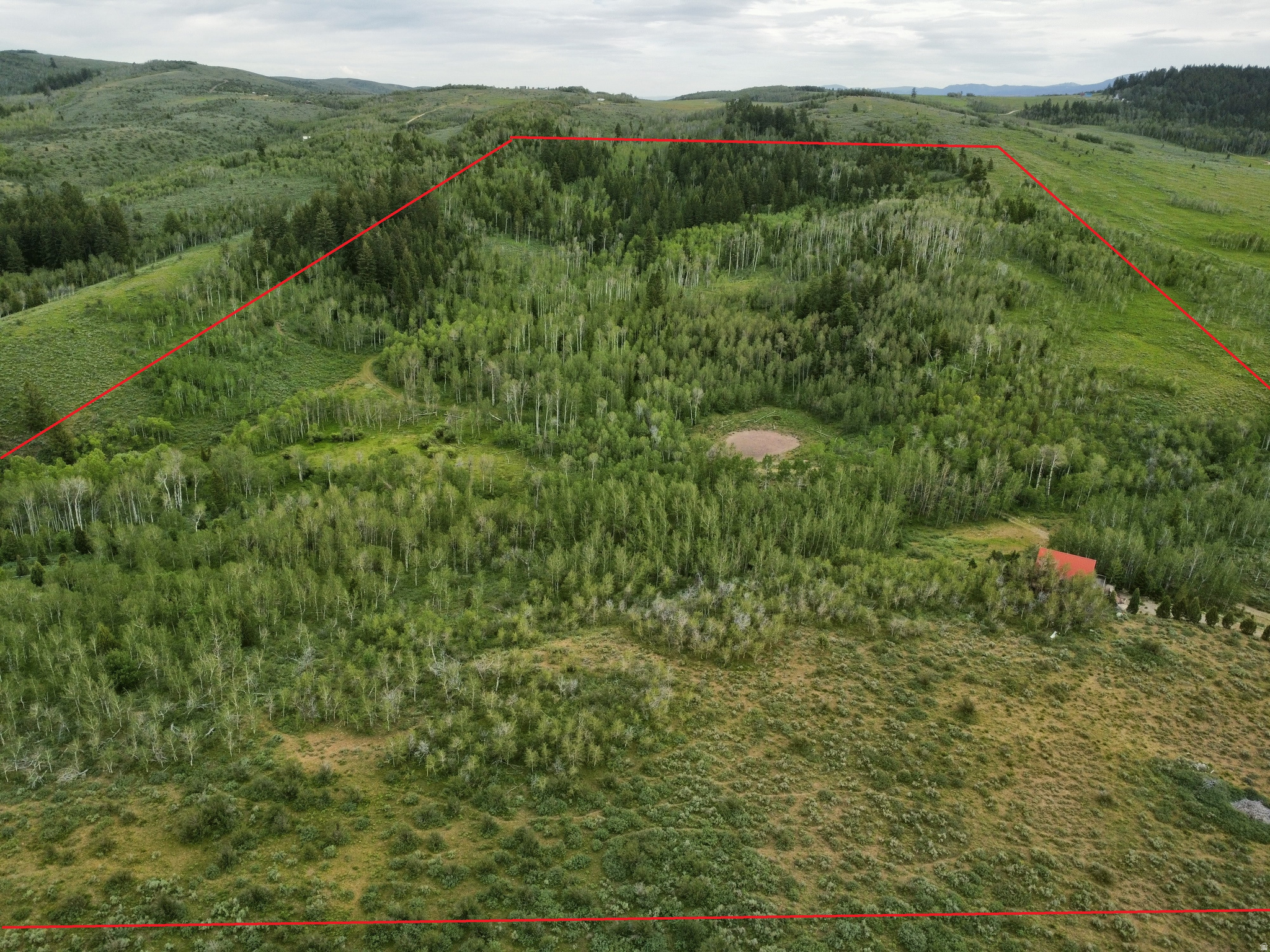 Private mountain retreat on 80 acres. Rare opportunity to own 80 acres of beautiful mountain property in Bear Lake County, Idaho. This heavily timbered parcel features a stunning mix of mature aspen and pine trees, offering exceptional privacy, abundant wildlife, and endless recreational opportunities.  A spring-fed creek flows through the property and feeds a scenic pond, creating a picturesque setting and enhancing the property's natural appeal. The spring also provides a culinary water source for the cabin.  The existing off-grid cabin is tucked among the trees and offers excellent potential as a hunting camp, recreational retreat, or future mountain getaway. The cabin currently has no utilities and is in need of repairs and updating, making this an ideal opportunity for buyers seeking a project property with incredible acreage and natural resources.  Enjoy hiking, ATV riding, hunting, and exploring your own private mountain retreat. With diverse terrain, mature timber, valuable water features, and a secluded setting, this property embodies the best of Idaho mountain living. Properties offering this combination of acreage, water, and privacy are increasingly hard to find.  Schedule your private showing today and discover the possibilities this unique Bear Lake County property has to offer.  Google Map Link https://maps.app.goo.gl/1v8msfTqvw2GvVg96
