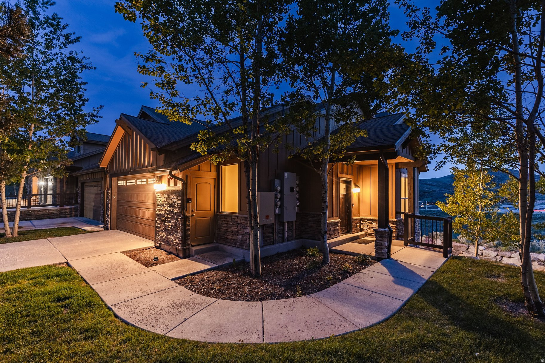 Stunning end-unit townhome with loads of natural light that combines comfort, convenience, and adventure in an exceptional mountain setting. Designed for easy main-level living with just one step from the spacious two-car garage to the open kitchen, living area with a cozy fireplace, spacious master suite, and an expansive deck for relaxing, barbequing, and taking in views of the Deer Valley and Park City ski areas. Downstairs, you'll find the ultimate gathering space with a huge home theater room (or bunk room) complete with a projector and full set of surround sound speakers. Beyond the theater room, you'll find a second primary suite, an additional bedroom, and a generous family room with a fireplace that opens to a patio complete with a large hot tub and beautifully landscaped backyard. Perfectly situated for an active lifestyle, this property offers quick access to scenic road & mountain biking routes, hiking trails, water recreation at Jordanelle Reservoir, and world-class skiing at Park City Mountain Resort and Deer Valley. Owners and guests also have the option to enjoy premium amenities at Black Rock Mountain Resort for an additional fee, including a heated outdoor pool, hot tub, spa, steam room, sauna, fitness center, public restaurant & bar, caf, shuttle service, and ice skating rinks. Whether you're searching for a full-time residence or vacation getaway, this Black Rock Ridge townhome delivers mountain living at its finest... If all that isn't enough, this home is only 10 minutes from the new Deer Valley East Village for ski access, 15 minutes to Park City Mountain Resort / Main Street, and only 35 minutes from the Salt Lake City International airport.