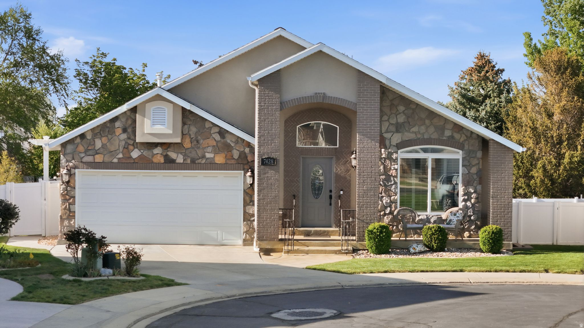 Meticulously maintained, this Midvale home stands out in its private gated community. Pride of ownership radiates at every turn - from the wrap-around deck to soaring ceilings, generous natural light, rich hardwood floors, and curated designer finishes. Every detail has been thoughtfully considered. The main level impresses with high-end appliances, a gas range, and a stunning primary suite complete with fireplace, walk-in shower, and beautifully organized his-and-hers closets. The walk-out basement features a spacious wide-stairwell entrance, 2 bedrooms, and dedicated office. Outside, one of the community's best yards awaits - fully landscaped for privacy, with a screened gazebo and garden area perfect for entertaining or unwinding. You'll look at the photos and think they're AI edited. They're not - schedule a private tour to see how you too can live like this. Centrally located and polished to perfection, this home doesn't just check the boxes - it raises the bar.