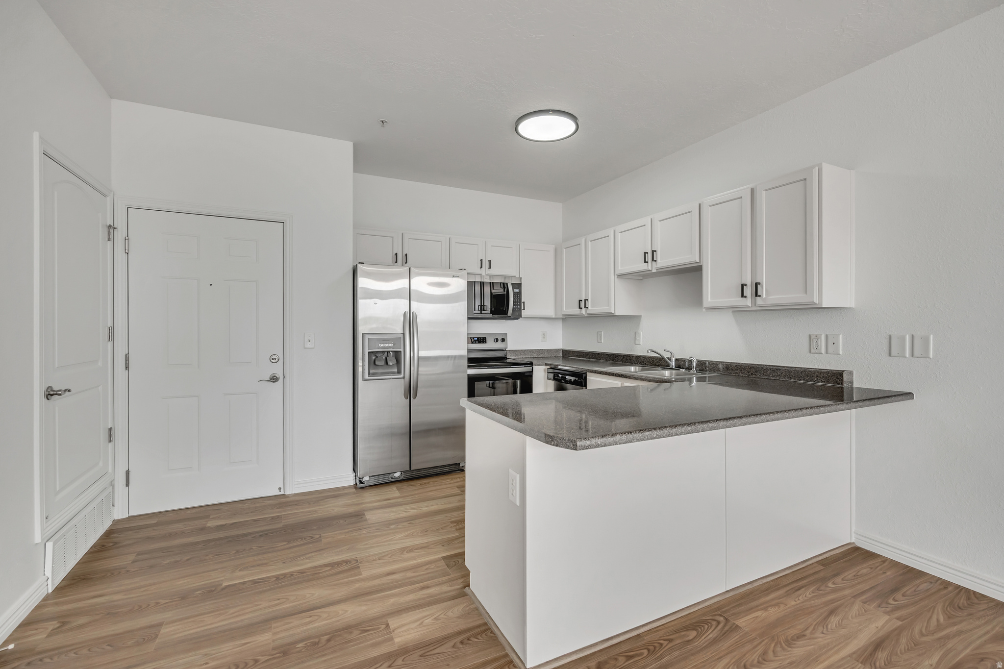 **Back On The Market** Buyers Financing Fell Through. Beautifully Remodeled Top-Floor Condo Offering Comfort, Convenience, And Updates Throughout. This 2-Bedroom, 2-Bathroom Unit Has Been Recently Updated, Featuring New Furnace, AC, Water Heater, Flooring, and Fresh Paint Throughout, For A Clean, Move-In-Ready Feel. The Open Layout Is Complemented By Modern Lighting, And A New Range And Dishwasher. Enjoy The Privacy Of Top-Floor Living Along With Secured Building Access And Secure Garage. Ideally Located With Quick Access To I-15, The Jordan River Parkway, Nearby Golf Courses, Shopping, And Dining - All Just Minutes From Downtown Salt Lake City And The Airport. Don't Miss This Turnkey Condo Offering Low-Maintenance Living In A Central Location!