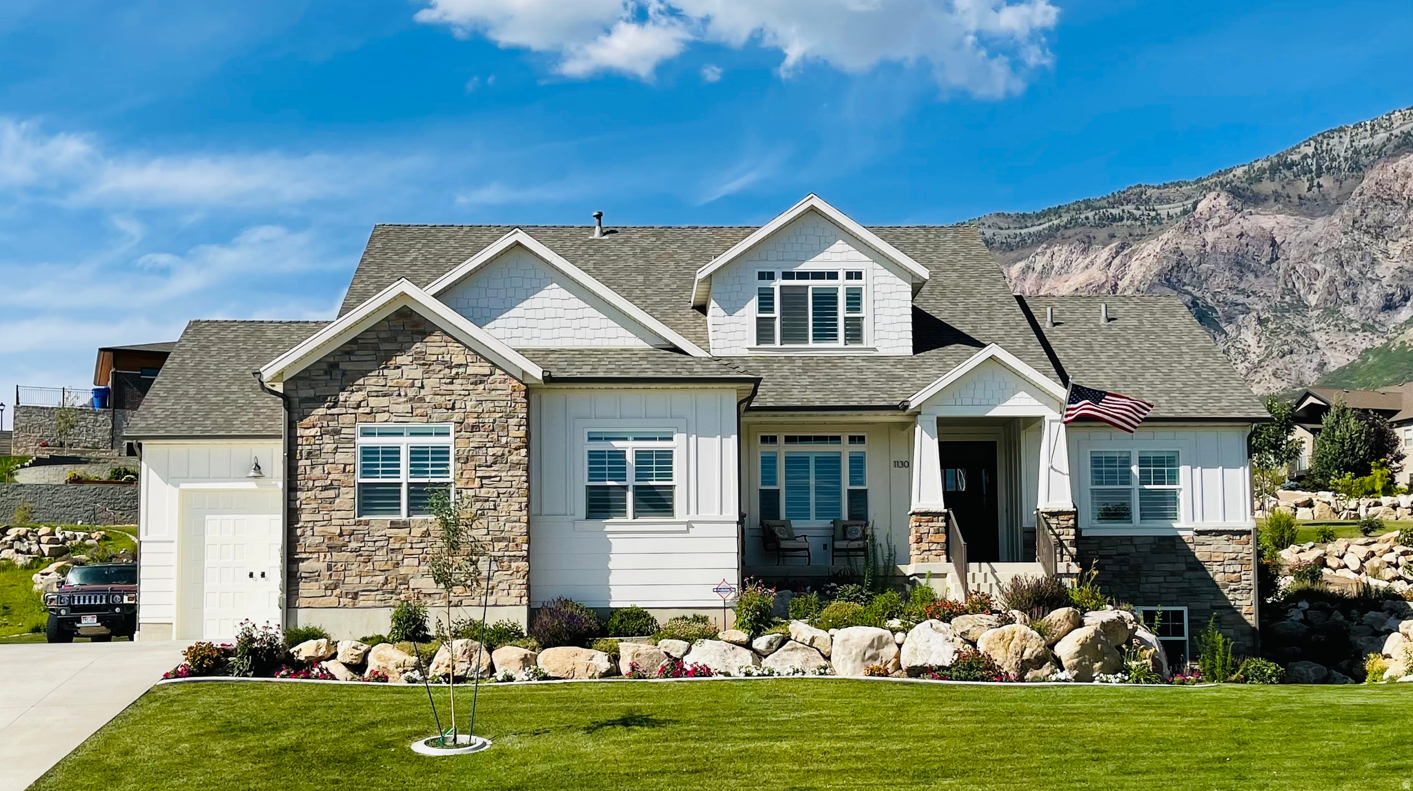 Custom Craftsman Home with Breathtaking Views in Deer Crest. Discover this stunning 5-bedroom, 3.5-bathroom home perched high on the bench in the sought-after Deer Crest community. With unparalleled mountain and valley views, this fully finished home offers elegant design, functional spaces, and premium features throughout. Main Level: Open-concept living room with a gas fireplace, Beautiful kitchen with granite countertops, island, pull-out drawers, stainless steel appliances and LVP flooring. Master suite with vaulted ceilings, walk-in closet & luxurious en-suite (jetted tub, separate shower, dual sinks with granite countertops), Private office with built-in desk and natural lighting,Main-level laundry for added convenience. Upper Level: Open family room, perfect for entertaining, Two bedrooms with ample storage, Full bathroom with modern finishes. Fully Finished Walkout Basement: Ideal mother-in-law suite, Second full kitchen with plenty of storage, Large family room with fireplace, Two bedrooms & full bathroom. Walkout entrance with plenty of natural light. Exterior & Additional Features: Three-car garage with oversized bay & RV pad, Large Patio for great outdoor living. Professionally landscaped, with stunning seasonal blooms, Covered back patio to enjoy mountain views year-round. This exceptional home combines comfort, style, and breathtaking surroundings. Don't miss your chance to own a piece of paradise in Pleasant View! Schedule a private tour today!