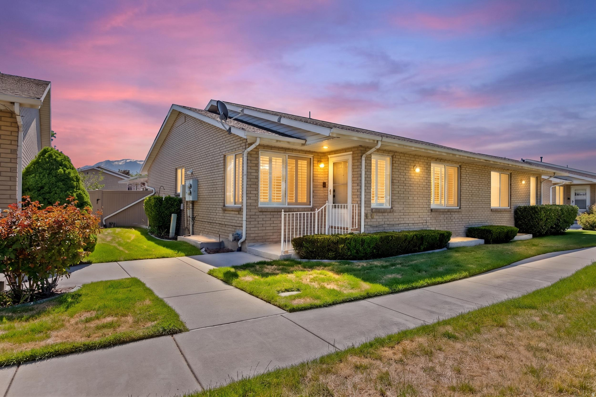 This beautifully remodeled townhome style condo offers the perfect blend of comfort, accessibility, and low maintenance living, all in a quiet, meticulously maintained community. With no neighbors above or below, only one shared wall, a private entrance, attached garage, and end unit location.  Designed with ease, safety, and functionality in mind, the main level offers highly desirable single level living with the primary suite, laundry, kitchen, and spacious living areas all conveniently located on one floor. Thoughtful accessibility upgrades throughout the home include wide hallways and doorways, grab bars, a roll in shower, and a stair lift included in the sale with a 400 pound capacity. Heated floors in the kitchen, dining area, and beautifully remodeled primary bathroom add an extra touch of luxury and comfort, while the custom cabinetry in the primary bath provides both style and functionality. Gas fireplaces on both the main and basement levels create a warm and inviting atmosphere throughout the home. The home also includes a whole house water filtration system and water softener for added comfort and convenience.  The oversized bedrooms offer exceptional flexibility and space, each large enough to accommodate king sized furniture with ease. The home also offers abundant storage. Downstairs provides additional living and bedroom space while maintaining comfort and accessibility features, including a hydraulic assisted basement window grate designed for quick and easy emergency exit access.  Step outside to enjoy the oversized covered patio and fully fenced outdoor space, perfect for relaxing, entertaining, or enjoying peaceful evenings in this clean, quiet neighborhood where pride of ownership shines throughout the community. This property also includes a rare private parking pad not shared with neighboring units, additional RV storage parking, and access to a community clubhouse ideal for family gatherings and special events.  Rarely does a home combine accessibility, privacy and spaciousness so seamlessly. This is truly a one of a kind opportunity for buyers seeking comfort, convenience, and peace of mind.