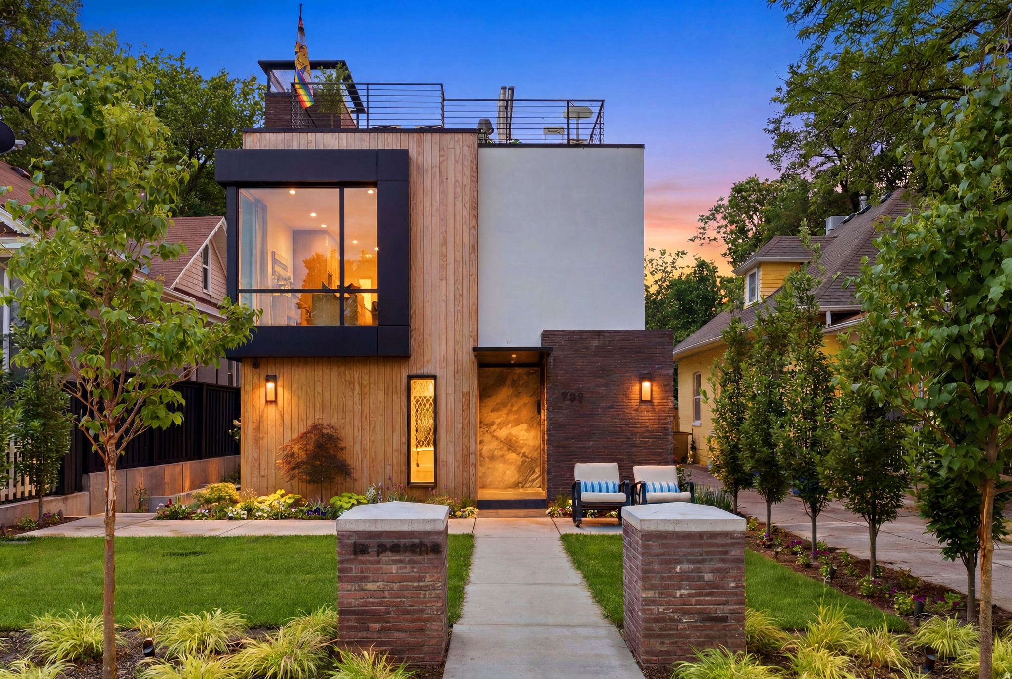 Experience elevated luxury living in the heart of the highly desirable 9th & 9th neighborhood with this newly built 2026 modern contemporary single-family residence. Offering 4,302 square feet of thoughtfully designed living space, this exceptional home blends architectural sophistication, high-end finishes and quality craftsmanship throughout. Expanded windows fill the residence with abundant natural light, while a curated mix of hardwood, tile, marble, limestone, slate, rugs and beautiful designer wallpaper creates a warm, refined and truly unique living experience.  The main level welcomes you with an inviting foyer and sitting area, leading into a stunning open-concept great room, dining area and beautifully appointed kitchen. Designed for both everyday living and elevated entertaining, the kitchen features high-end Bertazzoni appliances, a countertop range with range hood, coffee/dry bar, pantry, pull-out freezer and refrigerator drawers, beverage fridge in the island, soft-close cabinetry and exceptional storage. A beautiful hearth room offers a cozy and inviting place to gather, while the expansive folding doors create a seamless indoor-outdoor living experience where you can relax on the patio, complete with a drinking fountain and heated outdoor chairs. The main level also includes a powder bath, fireplace, garage entry with jacket hangers and direct access to the secure, gated driveway and garage area.  Upstairs, the home offers two private bedroom suites, a loft-style home office, laundry room with stackable washer and dryer, sink, cabinetry and storage, plus a linen closet and powder bath. The first bedroom suite features a fireplace, expanded windows, dual sinks, water room and open shower. The owner's suite is designed as a peaceful retreat with a European-style shower and bathtub, touch-activated LED bathroom mirror and elevated designer finishes.  The lower level expands the home's entertaining and lifestyle options with a second kitchen featuring GE appliances, waterfall quartz countertops, beverage fridge and built-in range, along with a living room, wet bar, table tennis area, laundry room, storage closets and multiple bathrooms, including both full and three-quarter bath options. This level provides incredible flexibility for guests, entertaining, recreation or extended-stay comfort.  One of the home's most impressive features is the rooftop entertainment area, designed for unforgettable gatherings and relaxed evenings. Enjoy a private hot tub, outdoor shower, BBQ, kitchen sink, beverage fridge, fireplace, dining area, outdoor furnishings and beautifully placed plants with an automatic watering system.  Additional highlights include a private security system, automatic gated driveway access to the garage, two-car garage with two EV charger outlets, one assigned parking space in front of the home, smart Nest thermostats, automatic shades, Sonos system throughout, zoned AC and forced air, tankless/on-demand hot water, water softener, stained glass windows, outdoor lighting, soft-close drawers throughout and generous storage on every level. The exterior showcases a sophisticated blend of brick, metal, pine, stone and stucco, complemented by a welcoming front lawn and low-maintenance xeriscaping along the side and backyard.  Located in one of Salt Lake City's most beloved neighborhoods, this luxury residence offers modern design, thoughtful comfort, added privacy and an unmatched lifestyle just moments from the dining, shopping and charm of 9th & 9th.